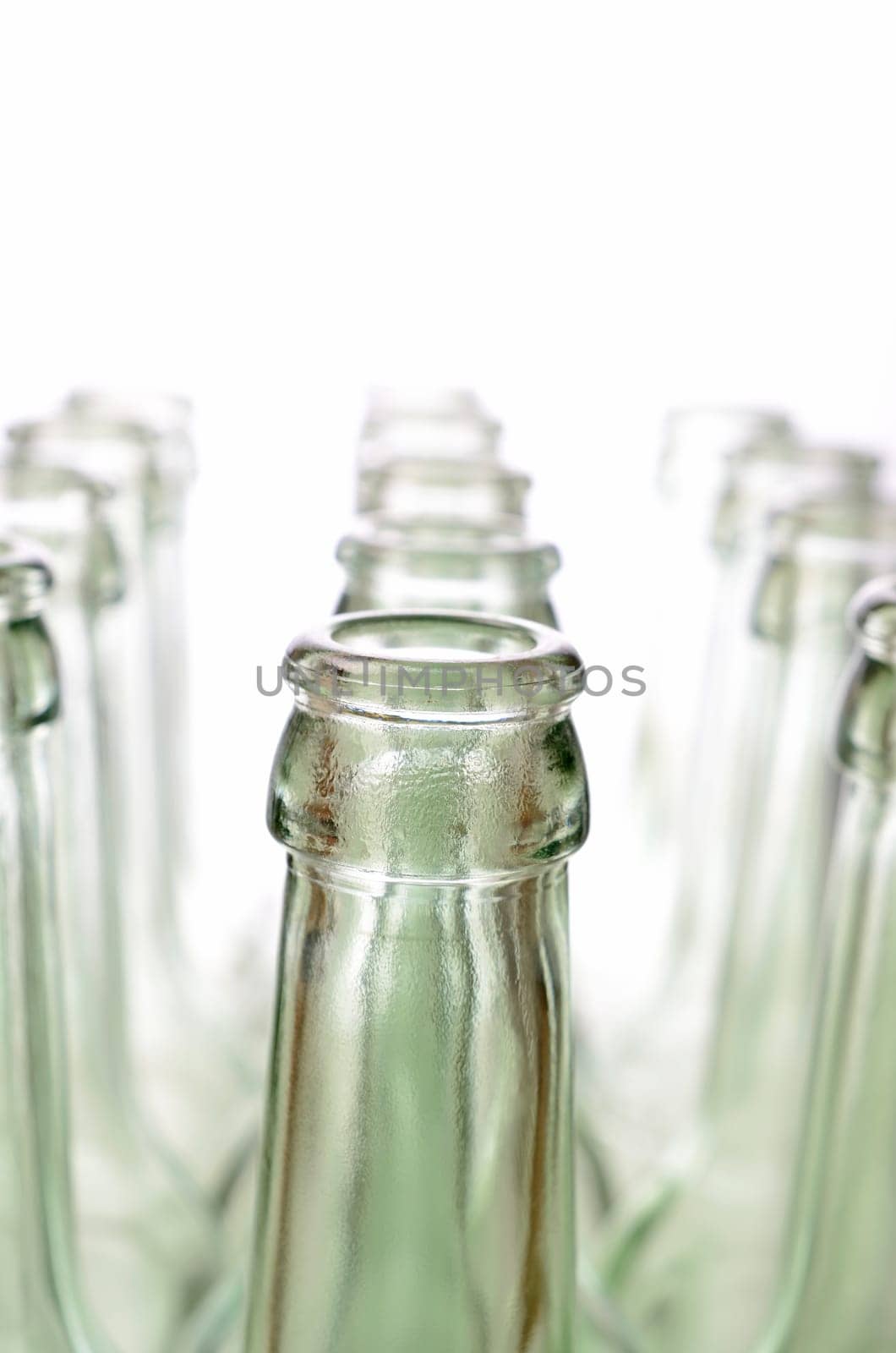 Empty bottles on a white background, selective focus on foreground
