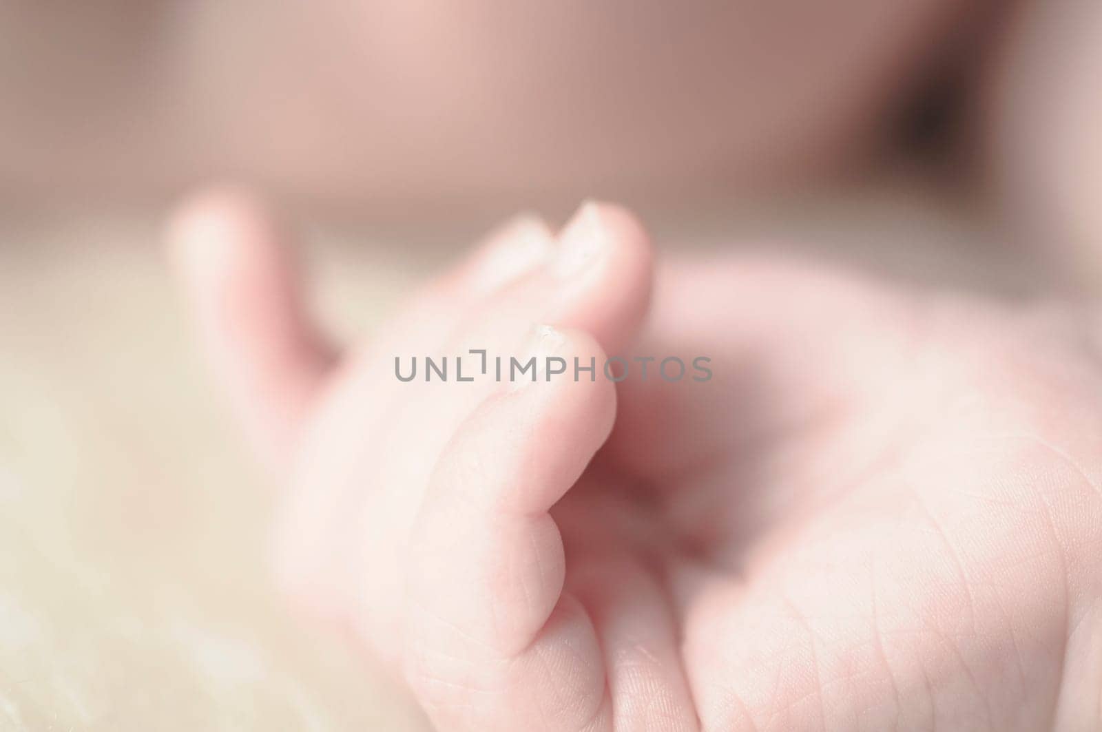 Close up of baby girls' sweet little hand and fingers