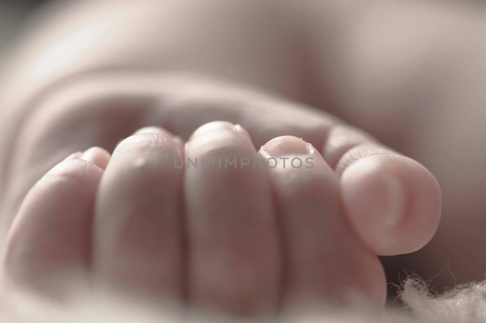 Close up of baby girls' sweet little hand and fingers