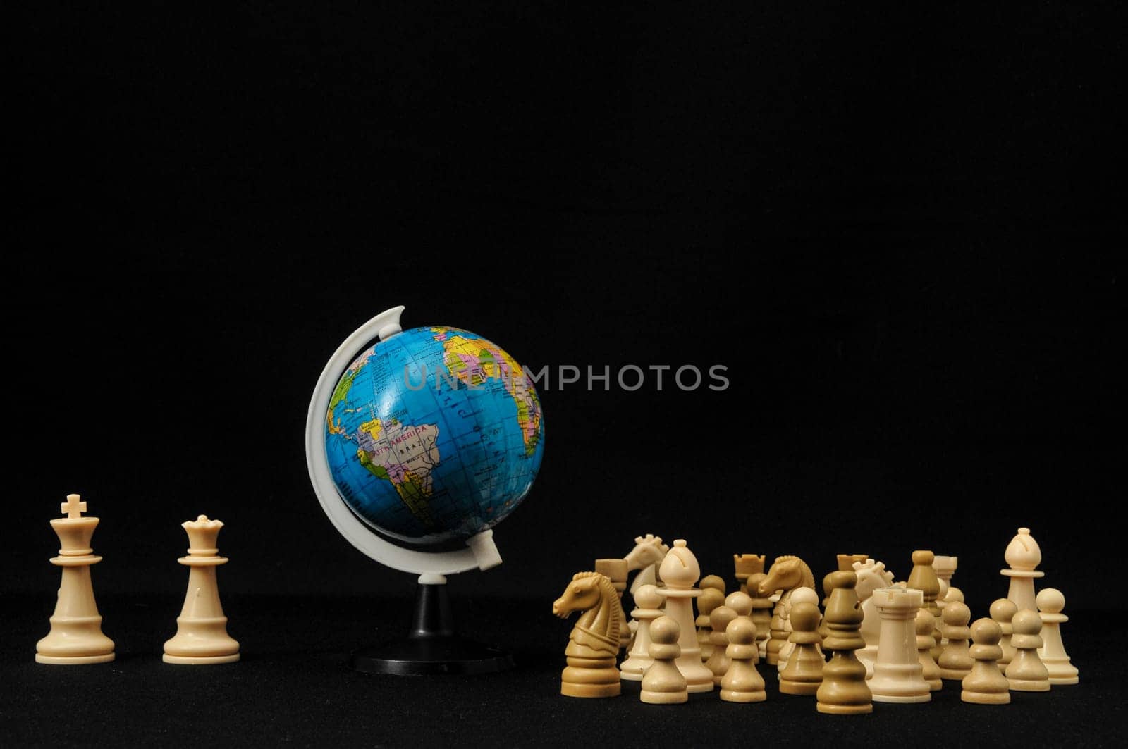 Globe And White Chess on a Black Background