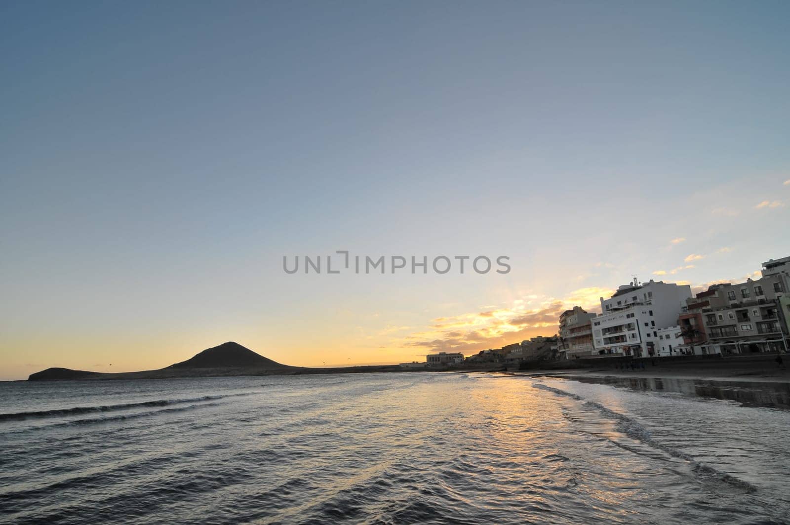 Sunset on the Atlantic Ocean with a Mountain in Background El Medano Tenerife Canary Islands Spain