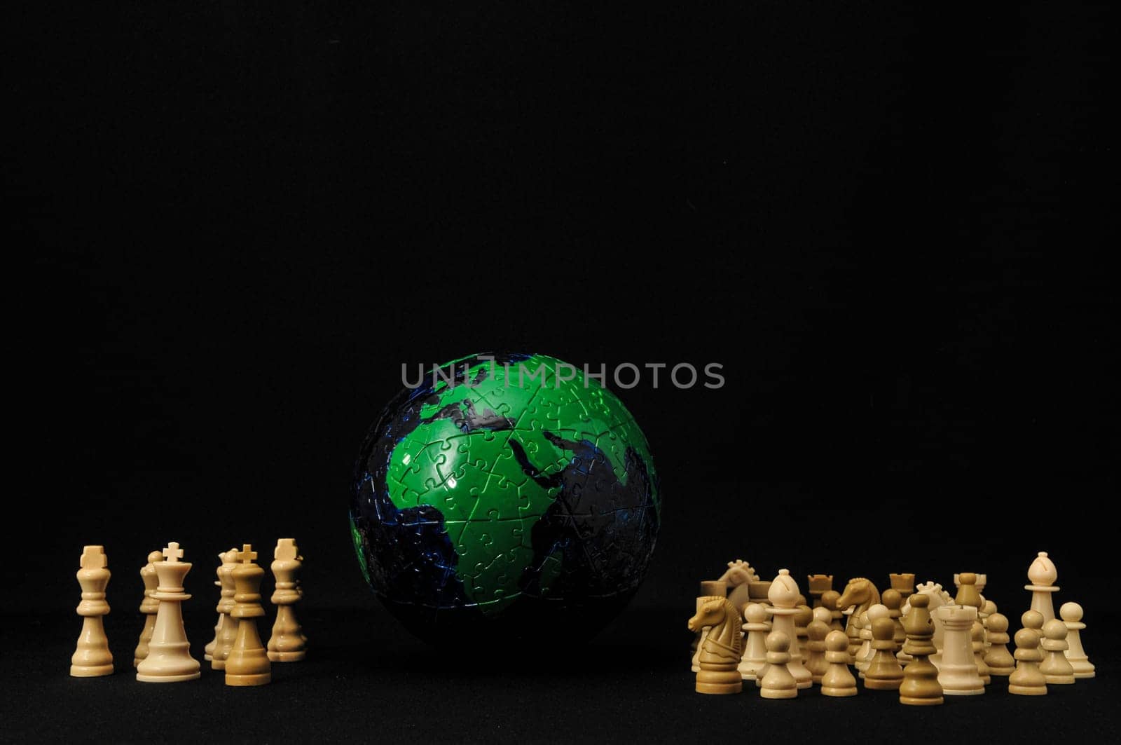 Globe And White Chess on a Black Background