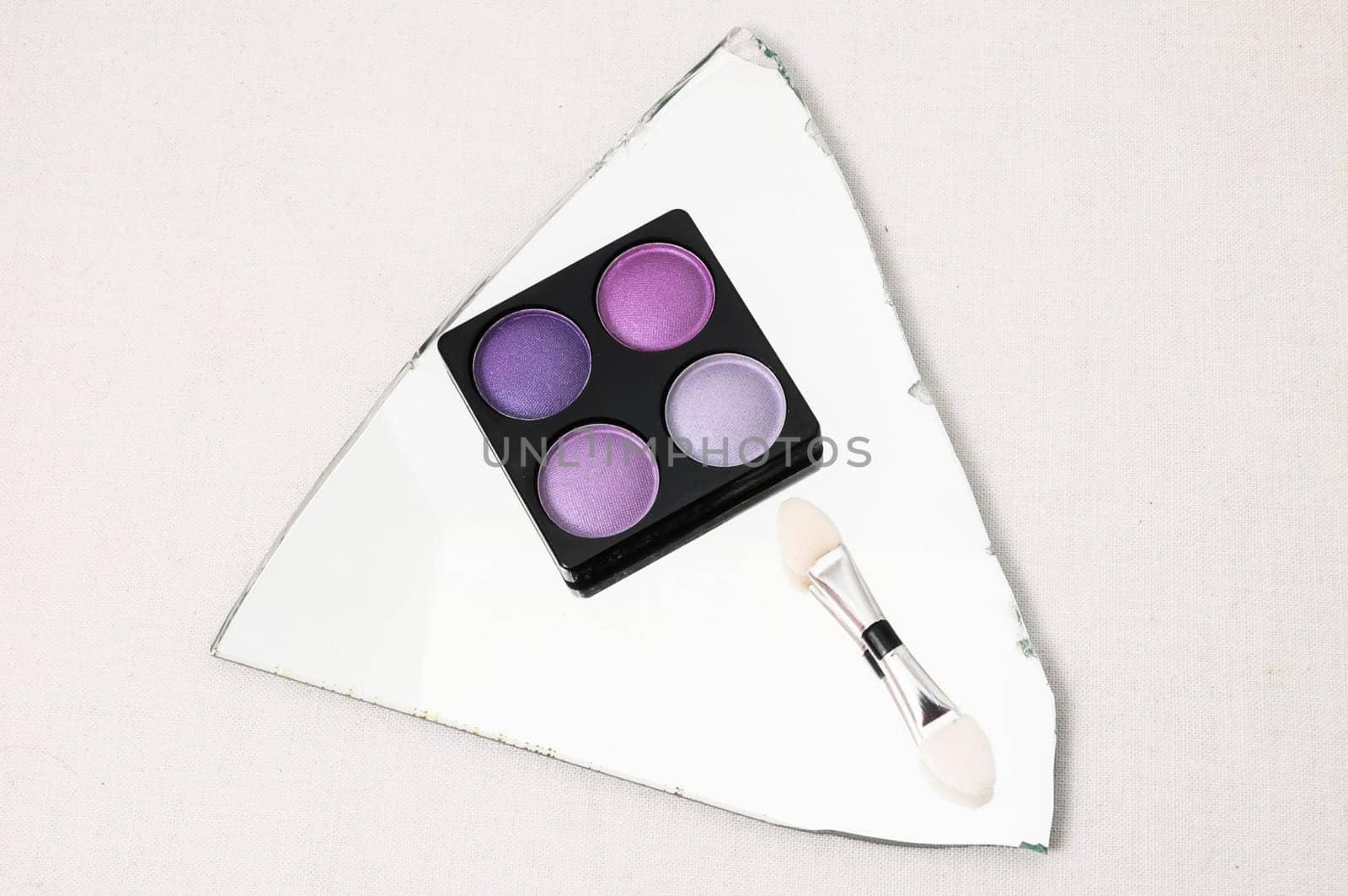 Make-up Palette Of Colorfully Eyeshadows Over White Background