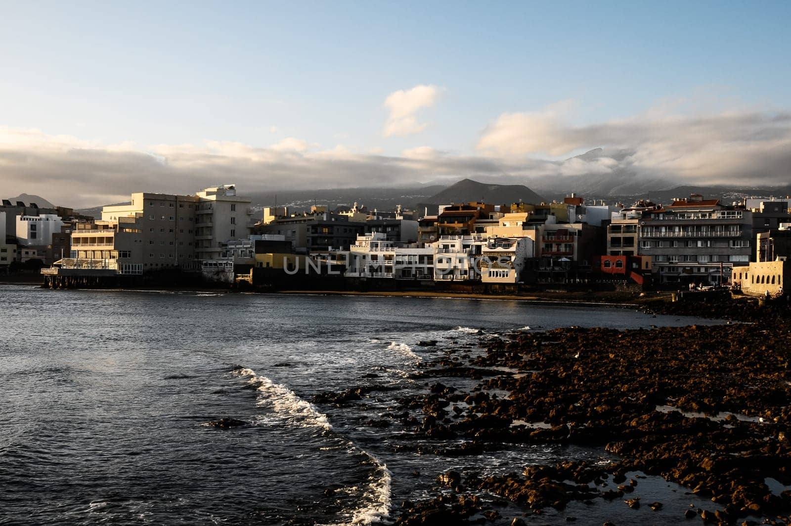 Sea and Building at Sunset in El Medano Tenerife Canary Islands