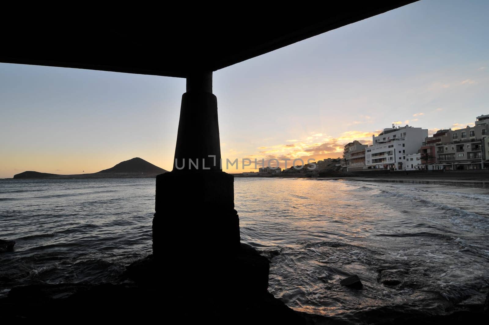 Sunset on the Atlantic Ocean with a Mountain in Background El Medano Tenerife Canary Islands Spain