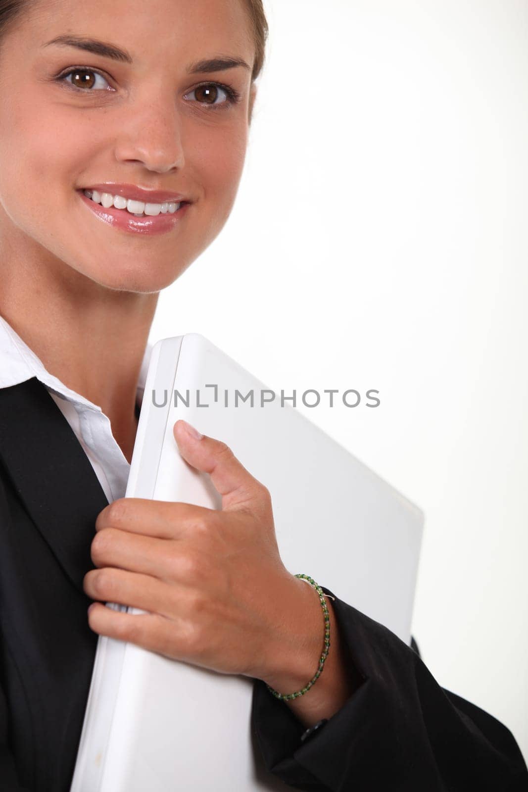 Businesswoman holding laptop