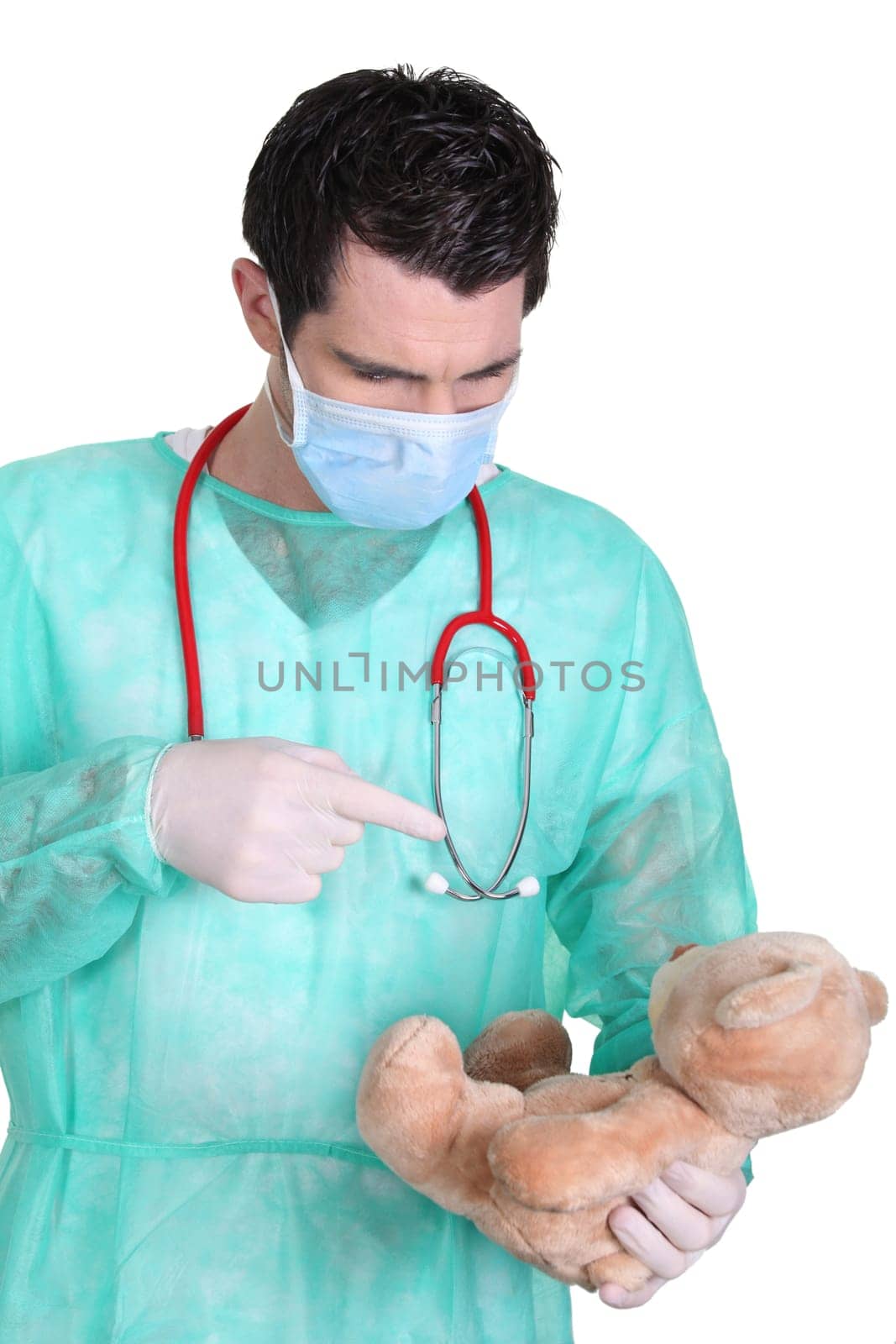 Doctor taking care of teddy bear