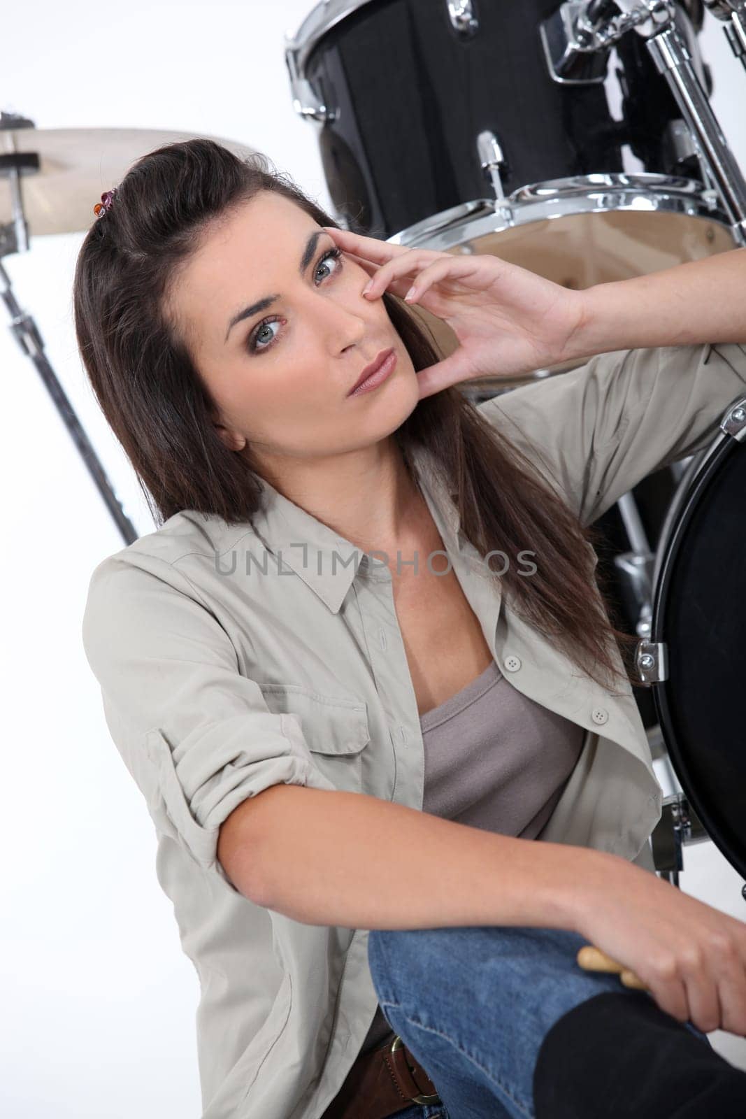 Woman about to play drums