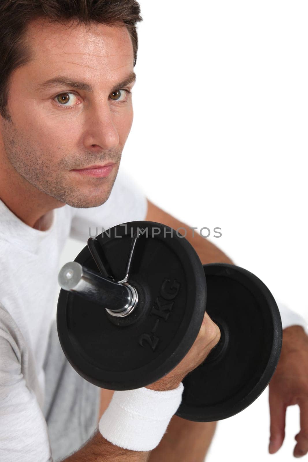 portrait of a man with dumbbell