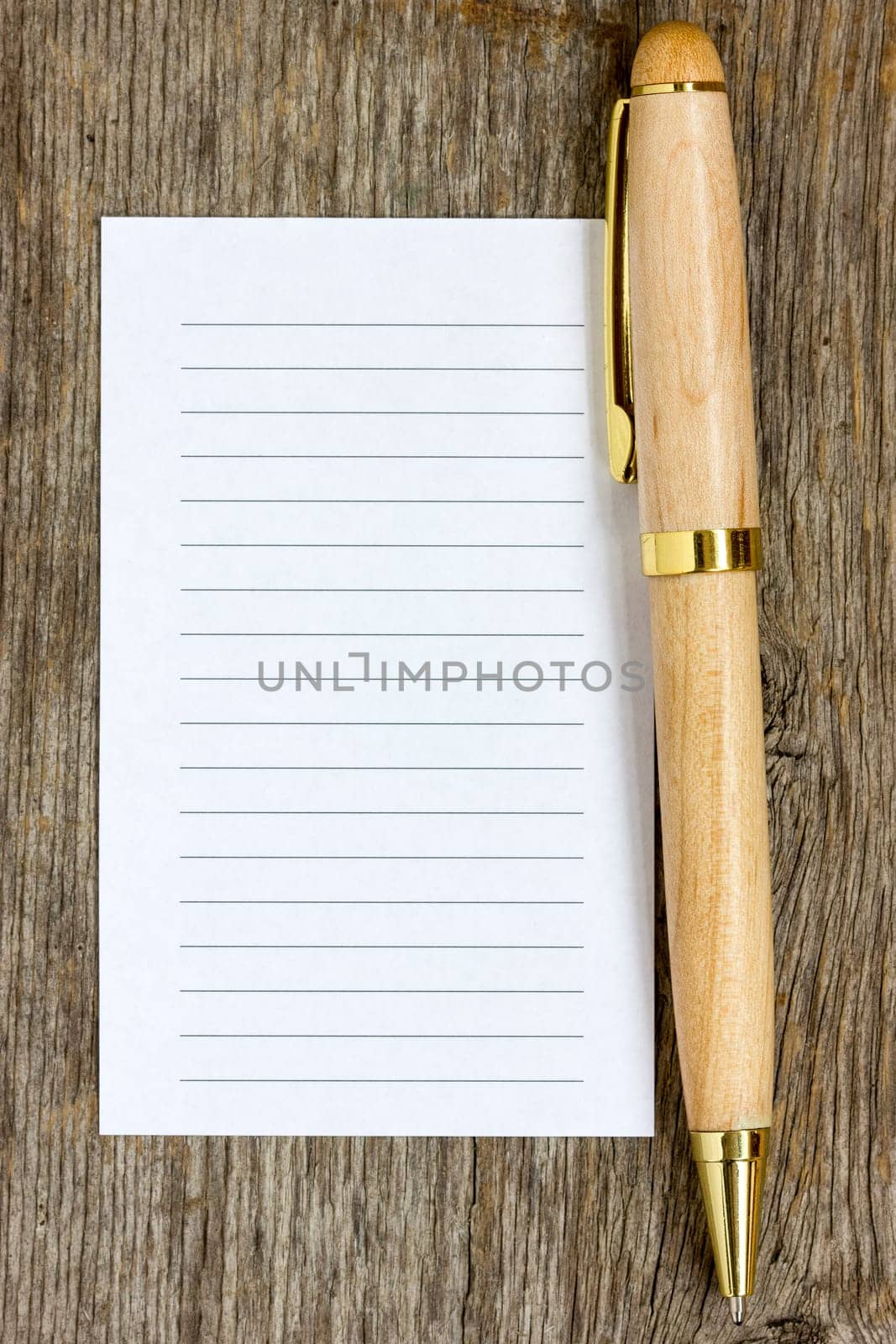 Wooden pen and note paper for your own text
