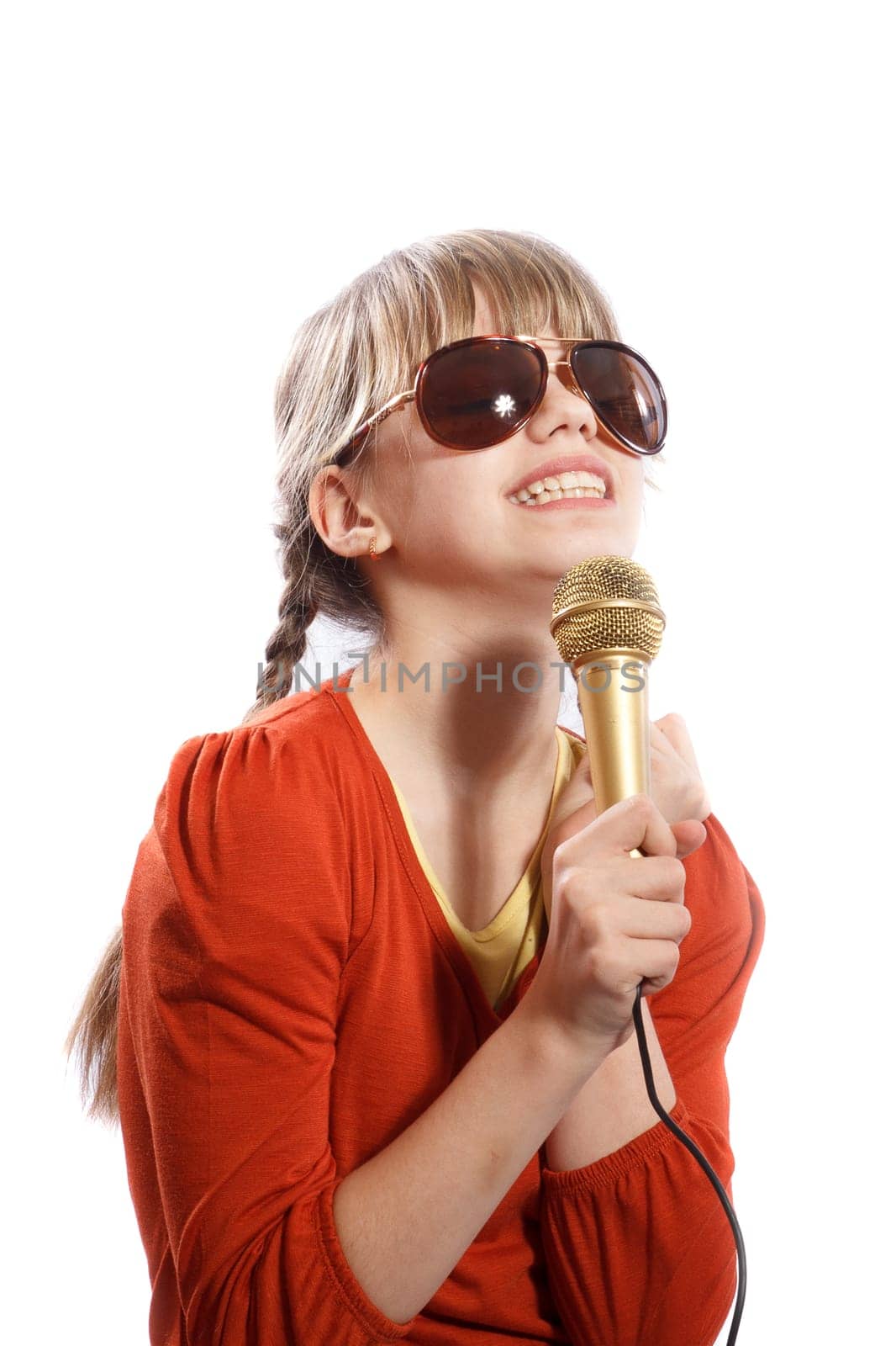 girl sings emotionally into the microphone on a white background