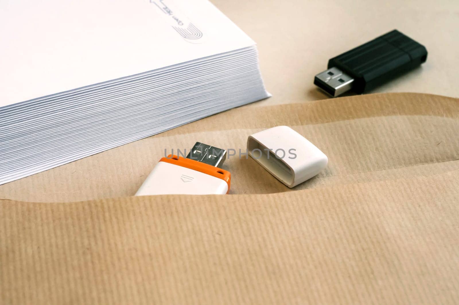 Stack of white envelopes and USB flash memory drives as concept