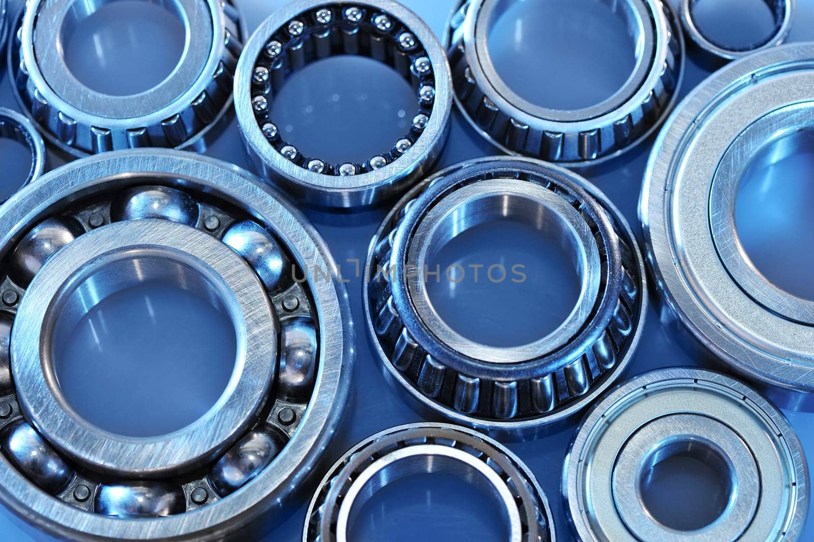 Close-up of various ball bearings in blue light