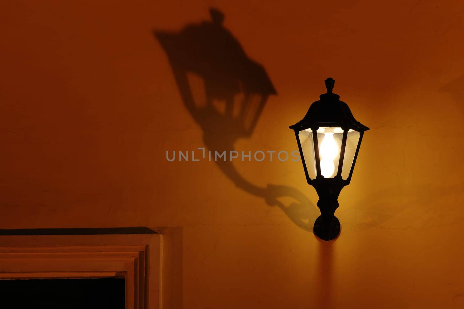 A vintage decorative lantern with shadow