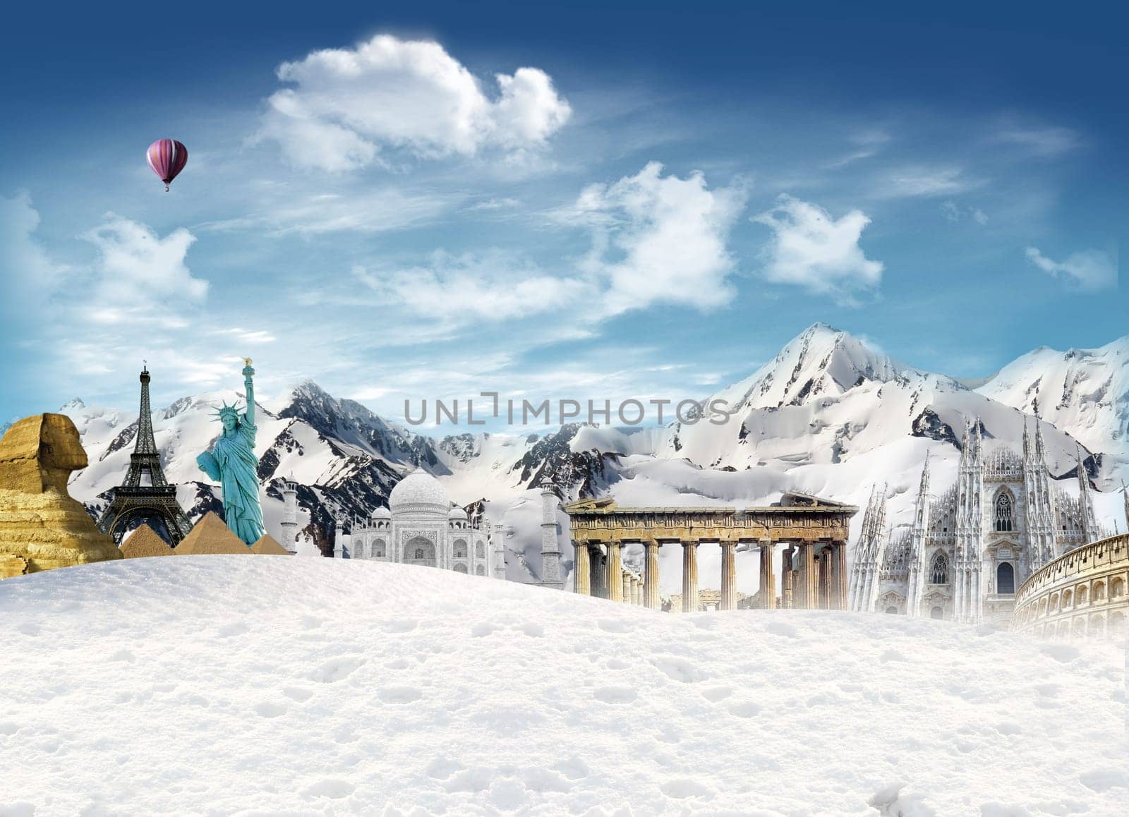 World landmarks among the mountain with snow and hot air balloon flying in the sky