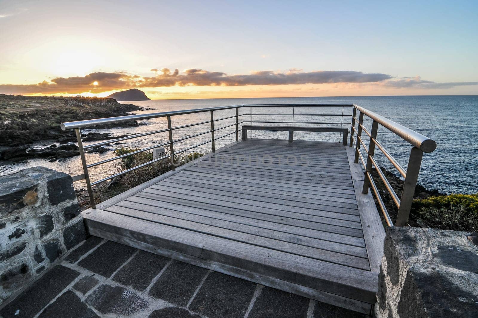 Sunrise on a Pier over Atlantic Ocean in Tenerife Canary Islands Spain