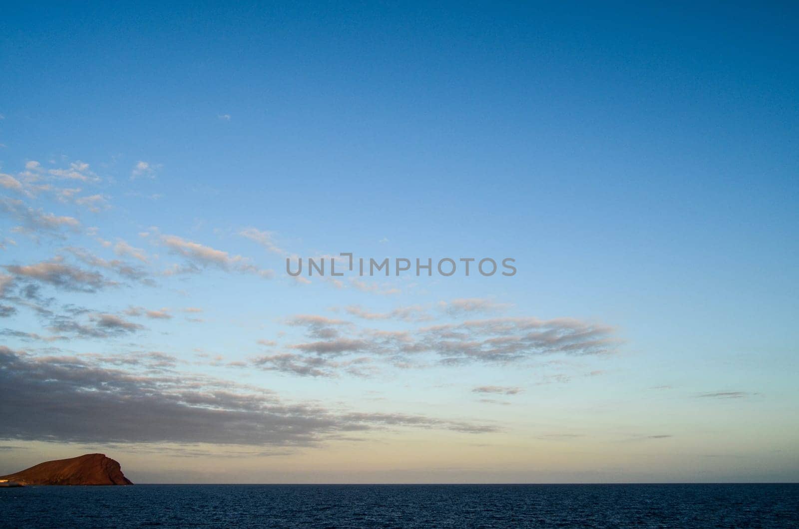 Cloudscape, Colored Clouds at Sunset near the Ocean