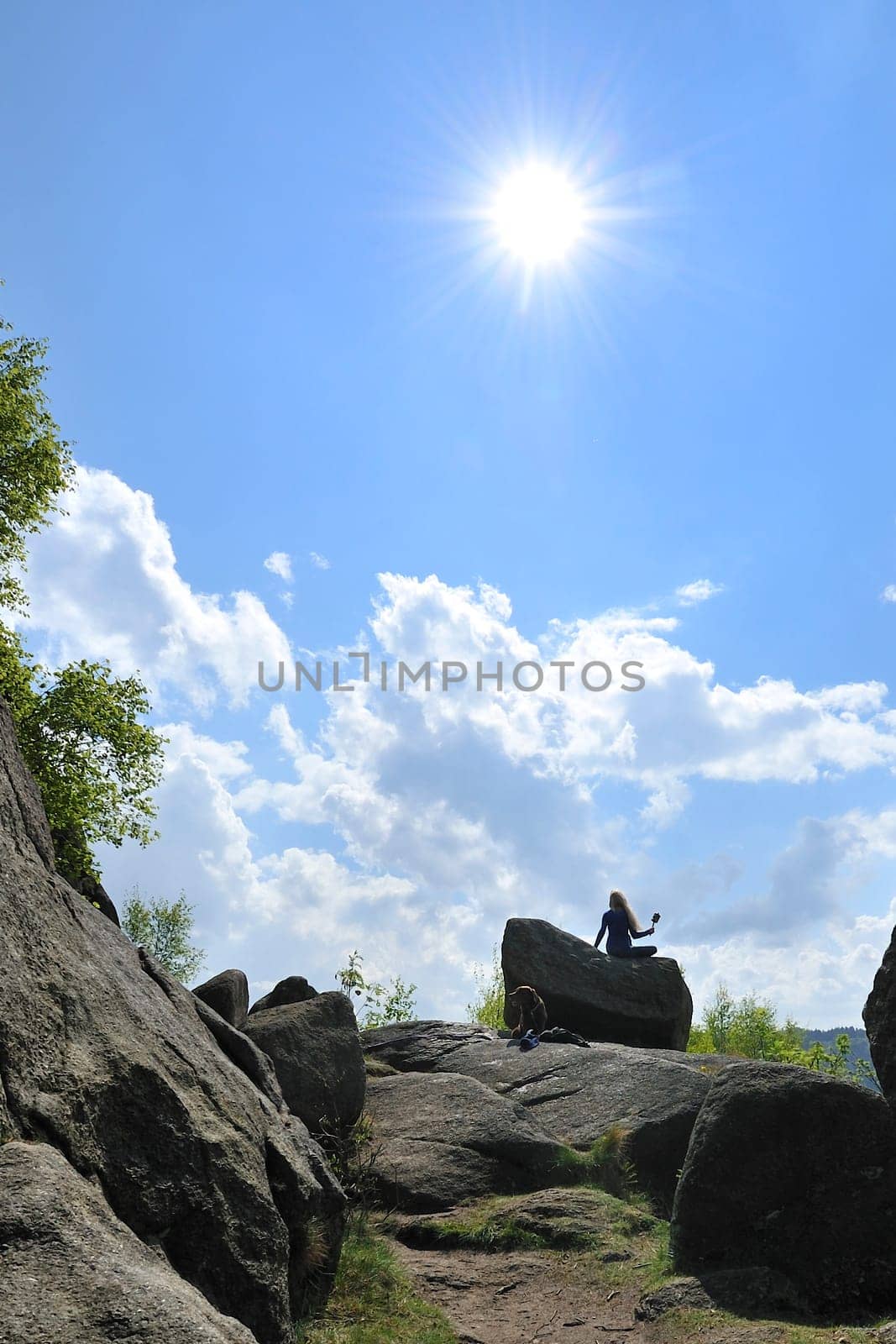 Woman with dog in Okertal,Harz,Germany.Praying wheel from Tibet.