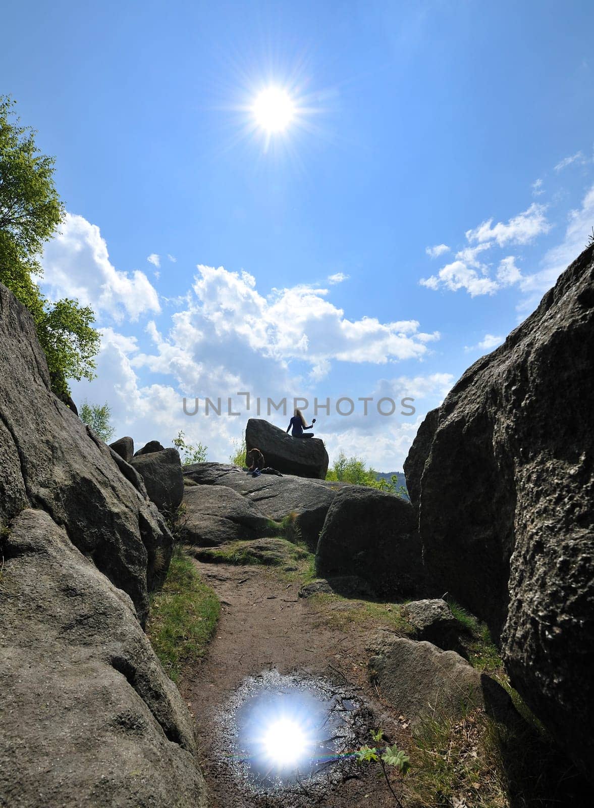 Woman with dog in Okertal,Harz,Germany.Praying wheel from Tibet.