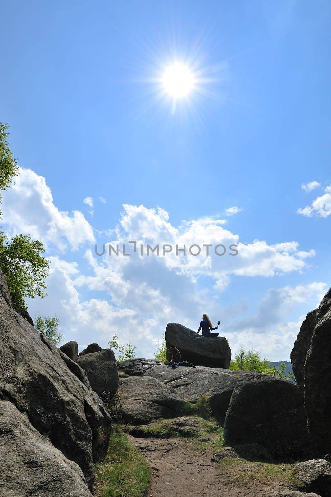 Woman with dog in Okertal,Harz,Germany.Praying wheel from Tibet.