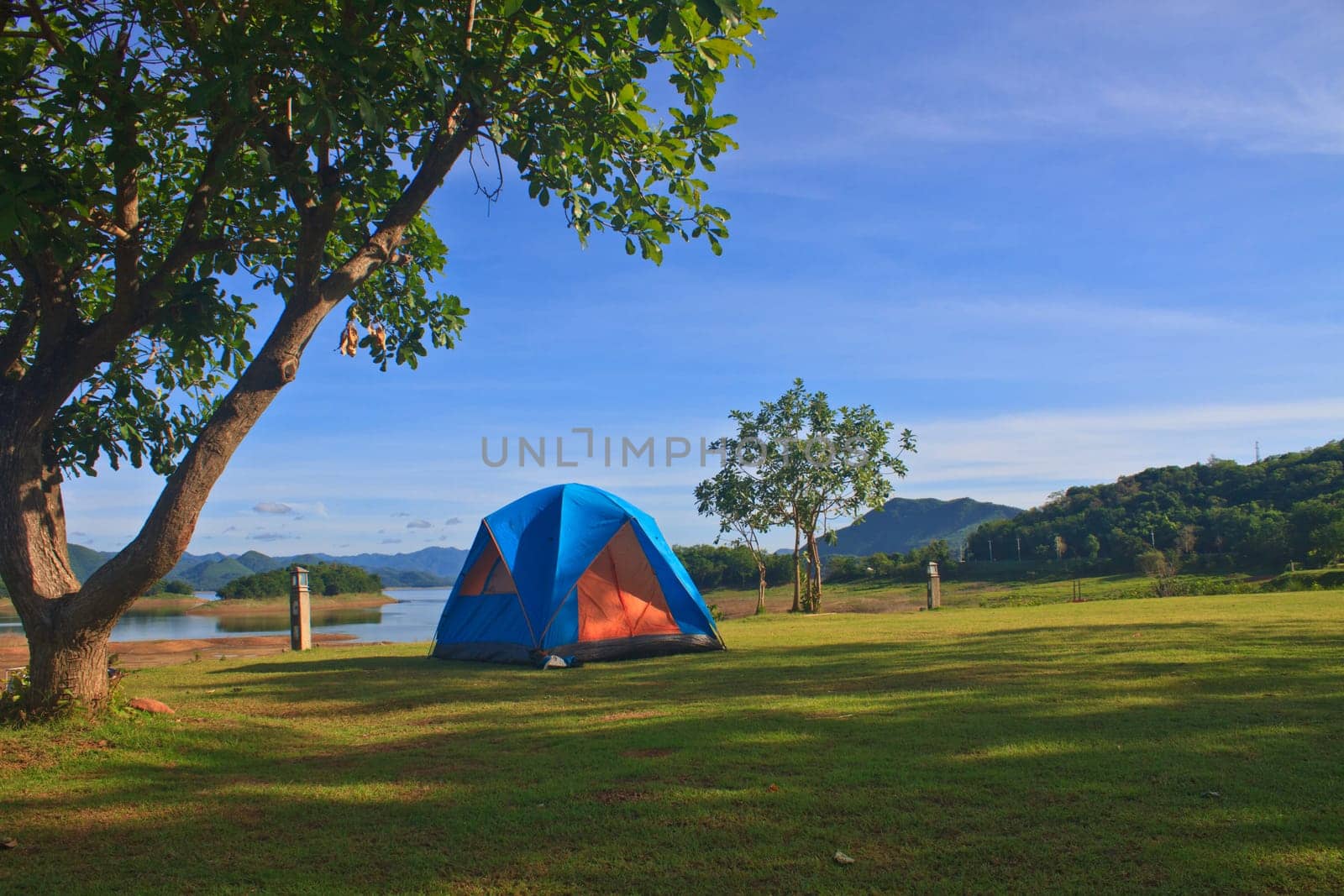 Camping in the wilderness, tent on campground in morning