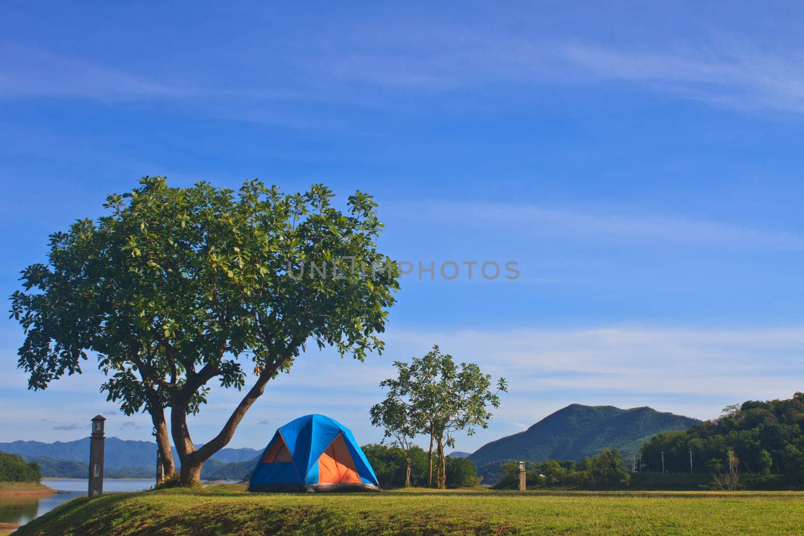 Camping in the wilderness, tent on campground in morning