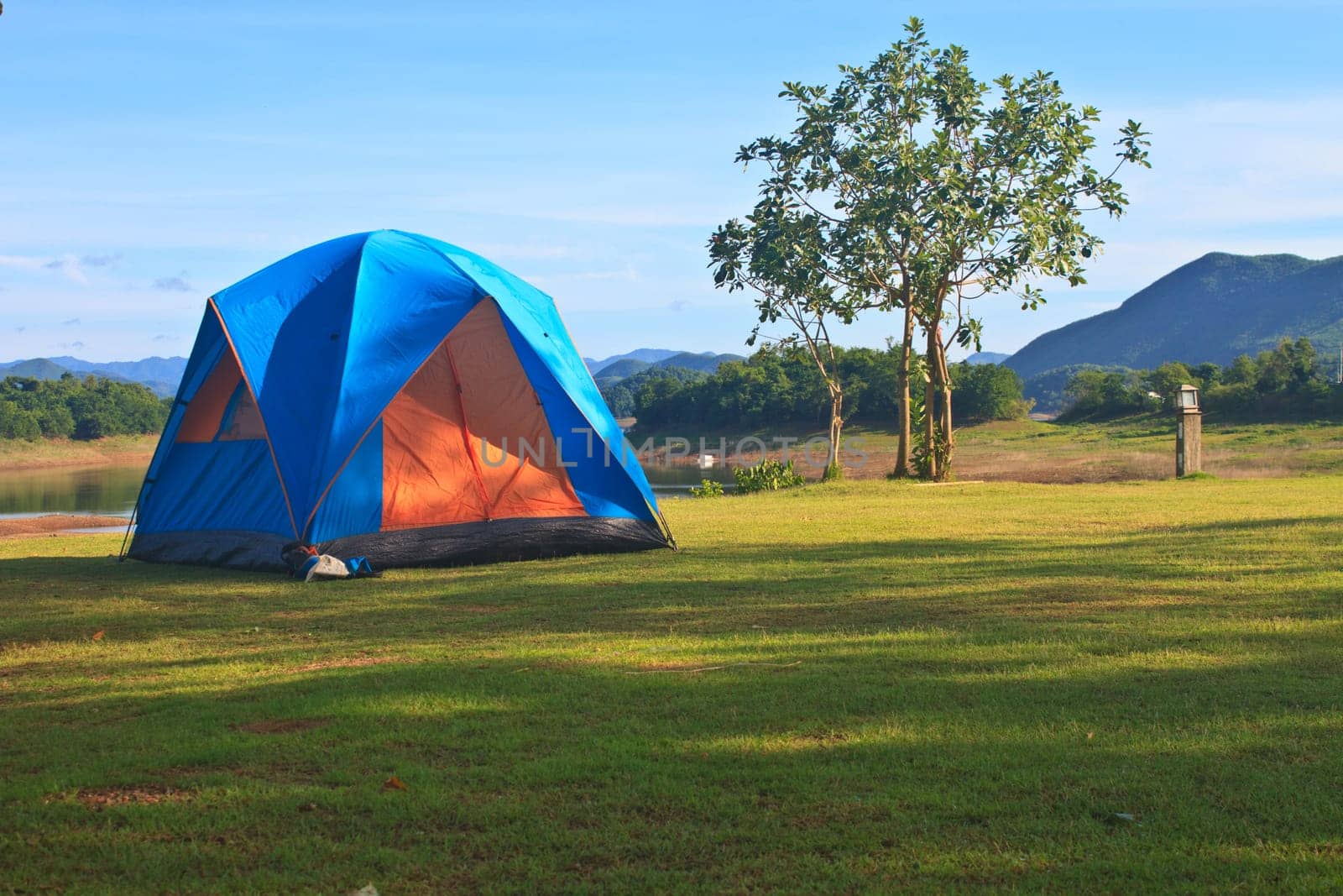 Camping in the wilderness, tent on campground in morning