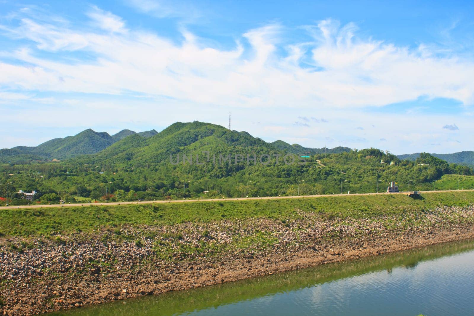 Kaeng Krachan Dam, Thailand, asphalt road and blue sky on top of DAM