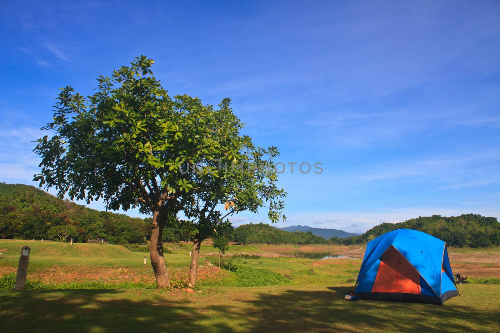 Camping in the wilderness, tent on campground in morning