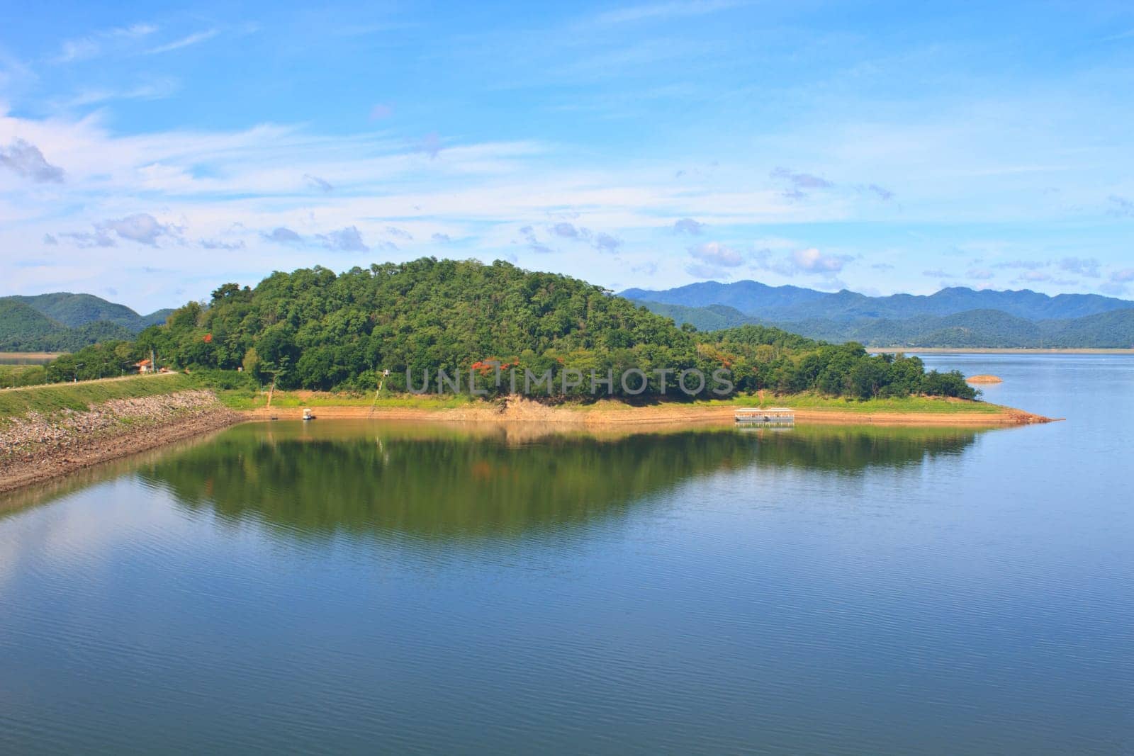 Kaeng Krachan Dam, Thailand, asphalt road and blue sky on top of DAM