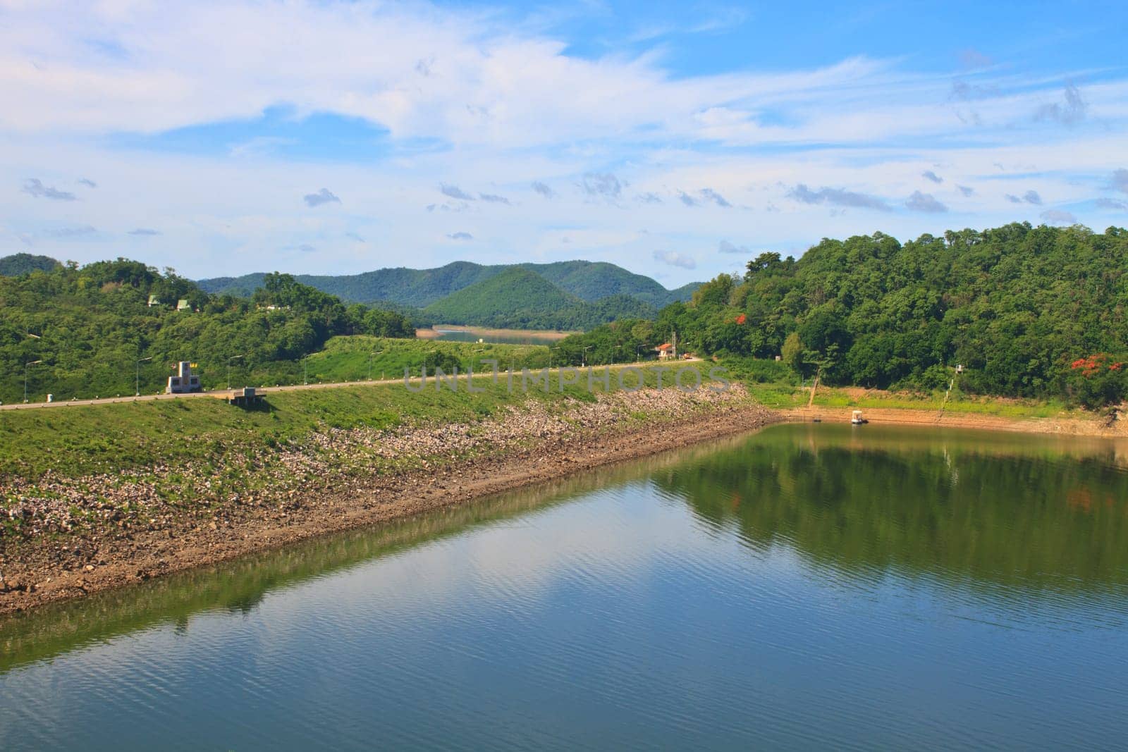 Kaeng Krachan Dam, Thailand, asphalt road and blue sky on top of DAM