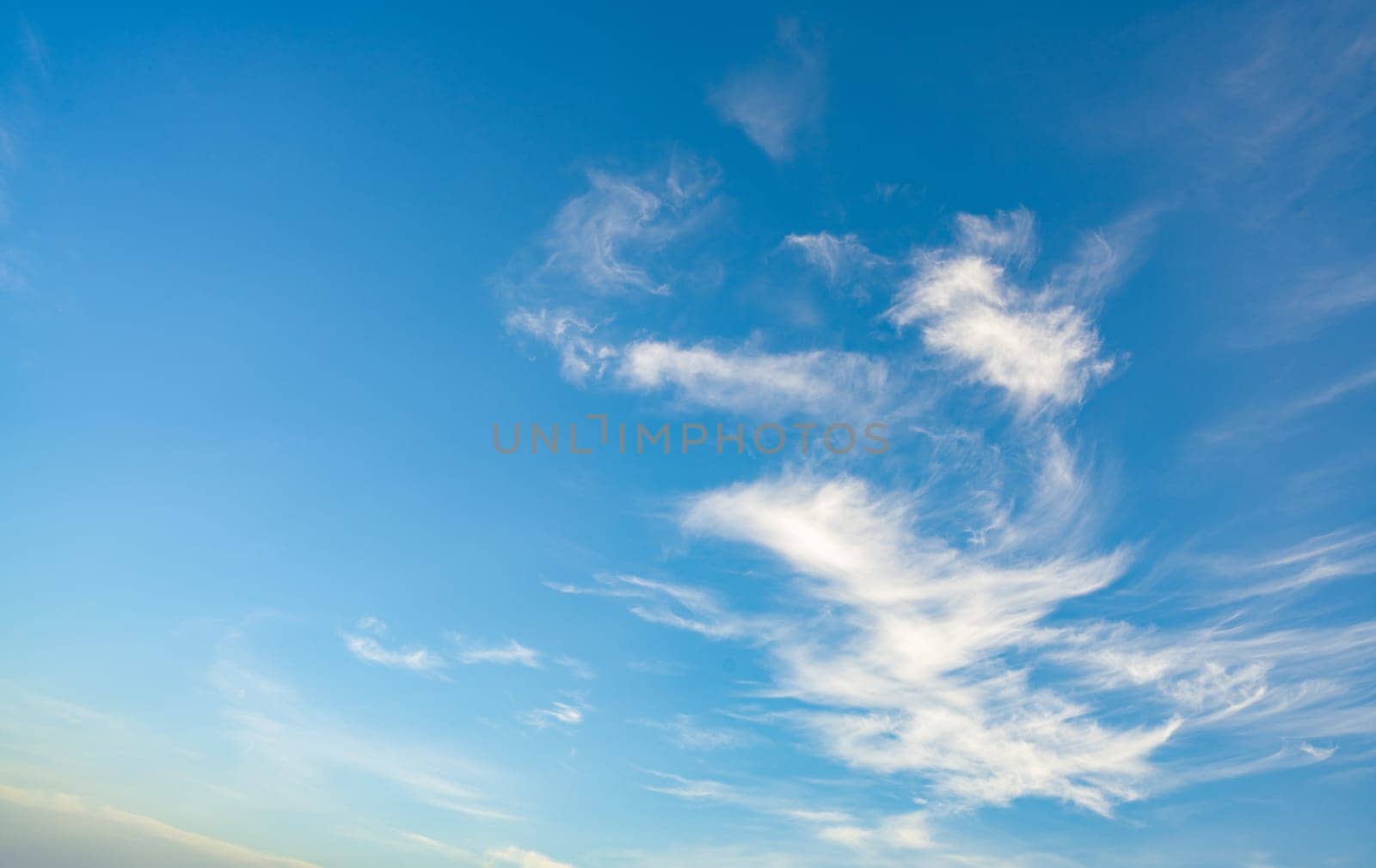 Blue sky and white clouds abstract background. Cloudscape background. Blue sky and fluffy white clouds on sunny days. Beautiful blue sky. World Ozone Day. Ozone layer. Sky in good weather day. by Fahroni
