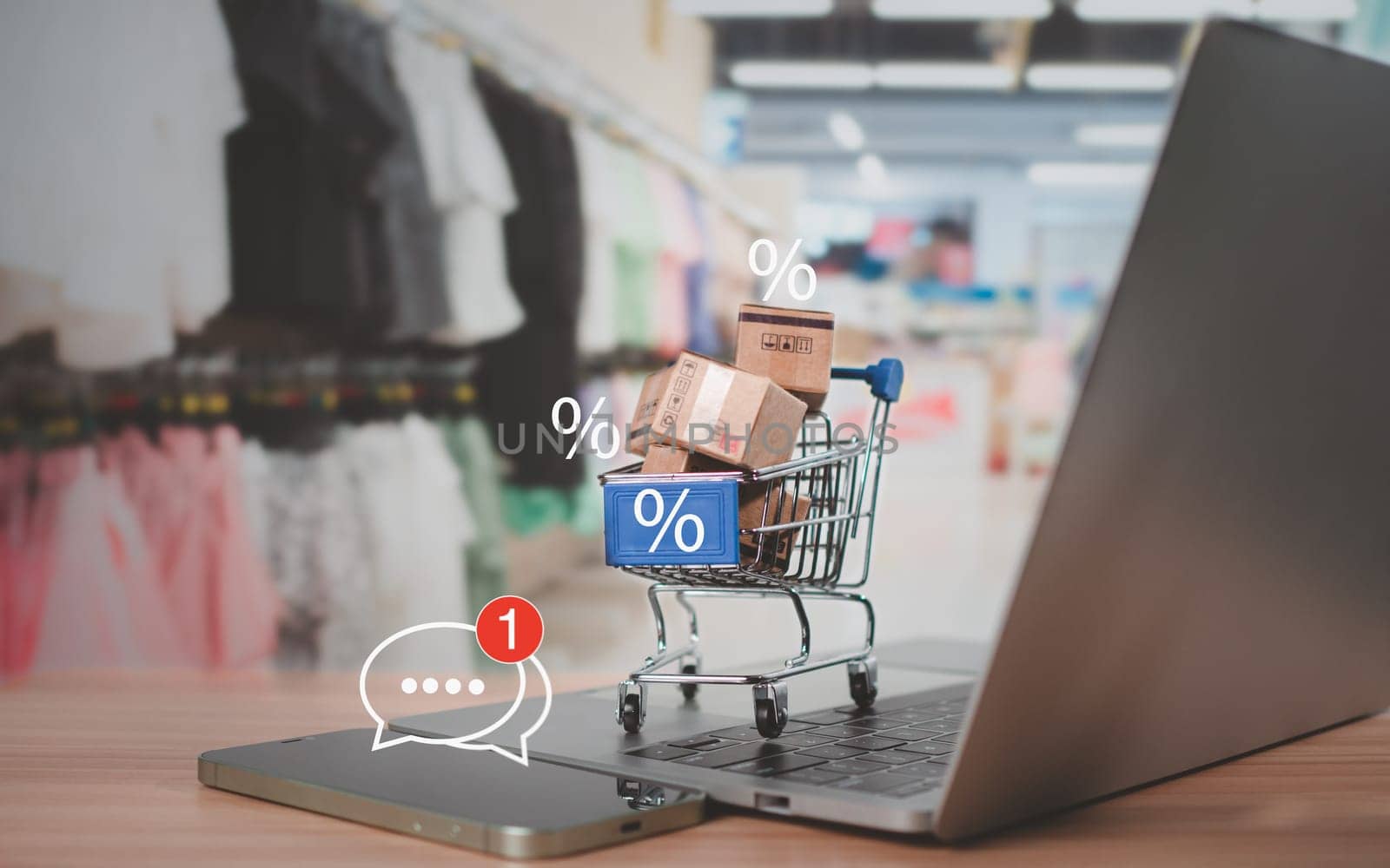 Sale percentage with shopping cart and boxes placed on computer keyboard. Online shopping concept, special price products, Special offers and promotions