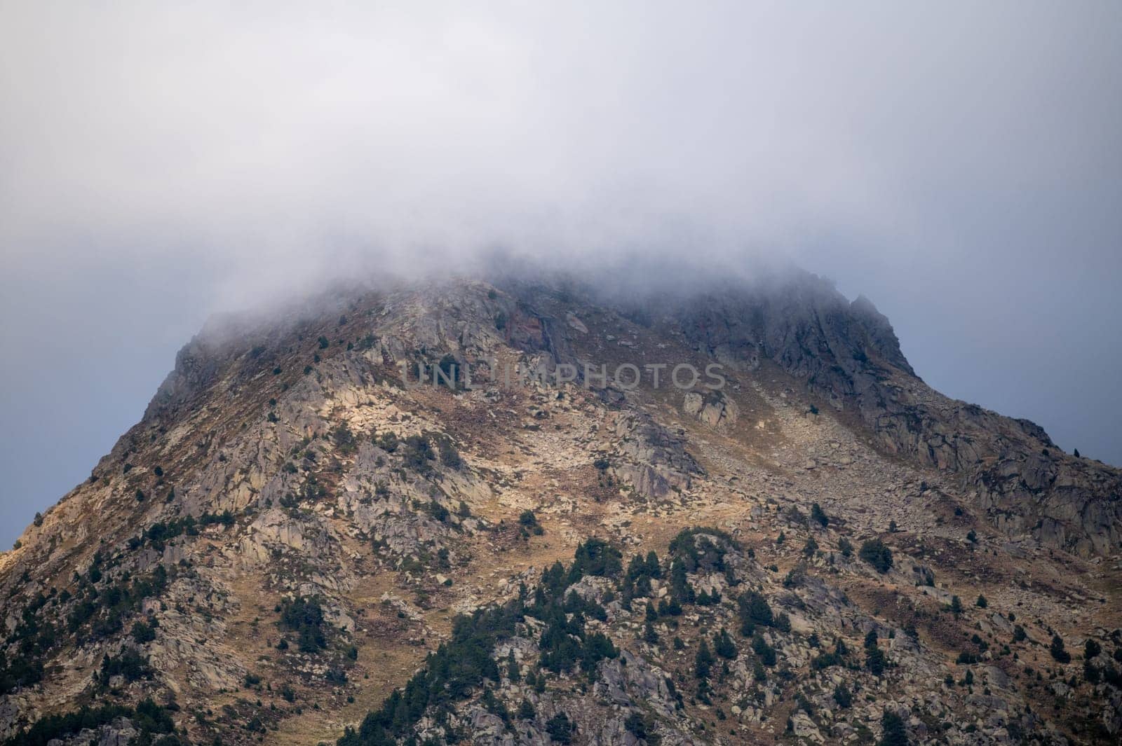 Mountain with fog in the Pyrenees in Andorra. by martinscphoto