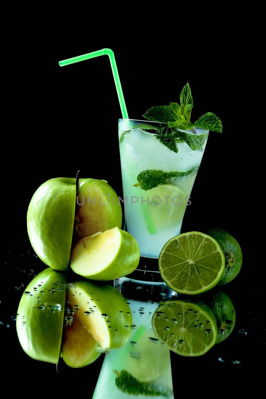 Mojito cocktail with green apple and line on a black background