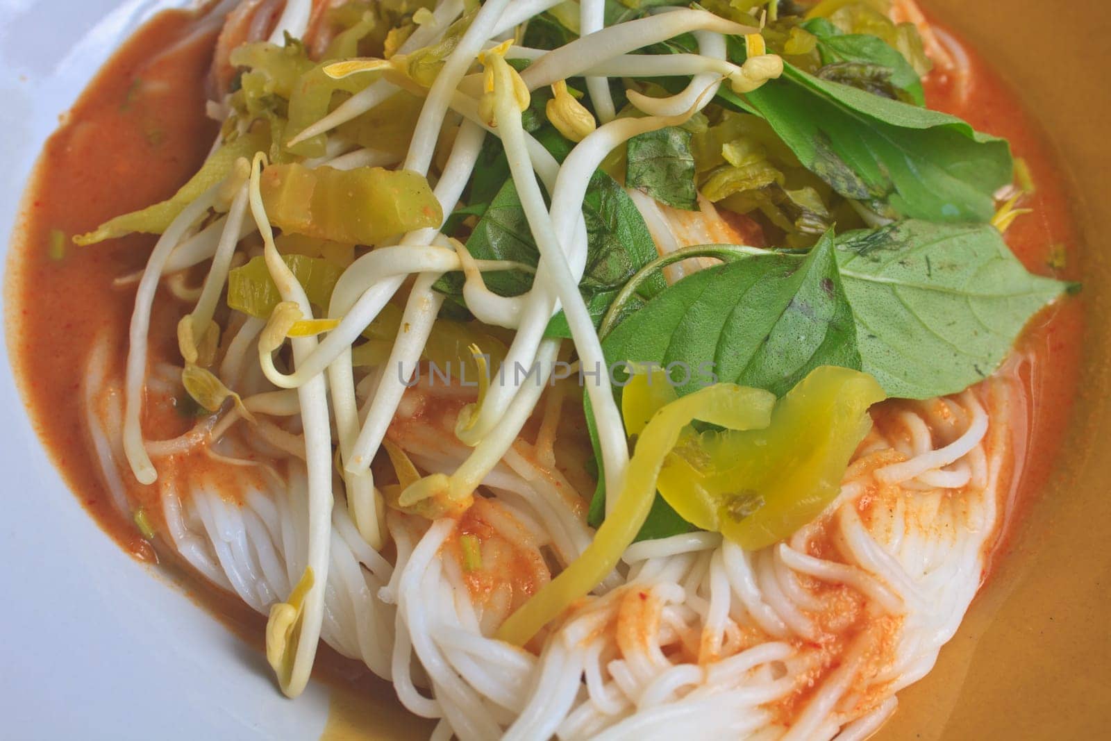 Thai vermicelli eaten with curry and vegetable close up