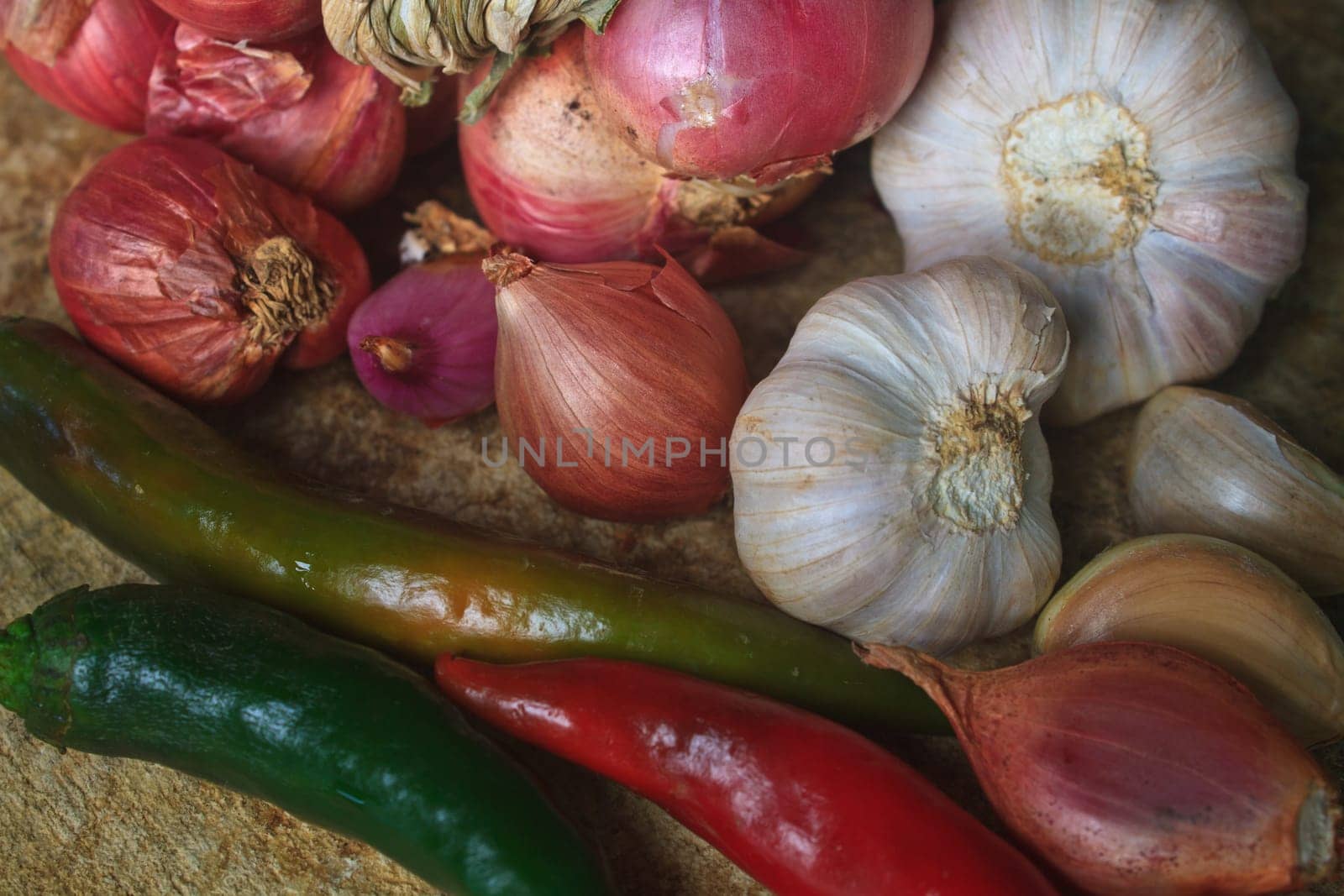 thai kitchen food spice herb pepper red onion garlic for cooking on top wood table