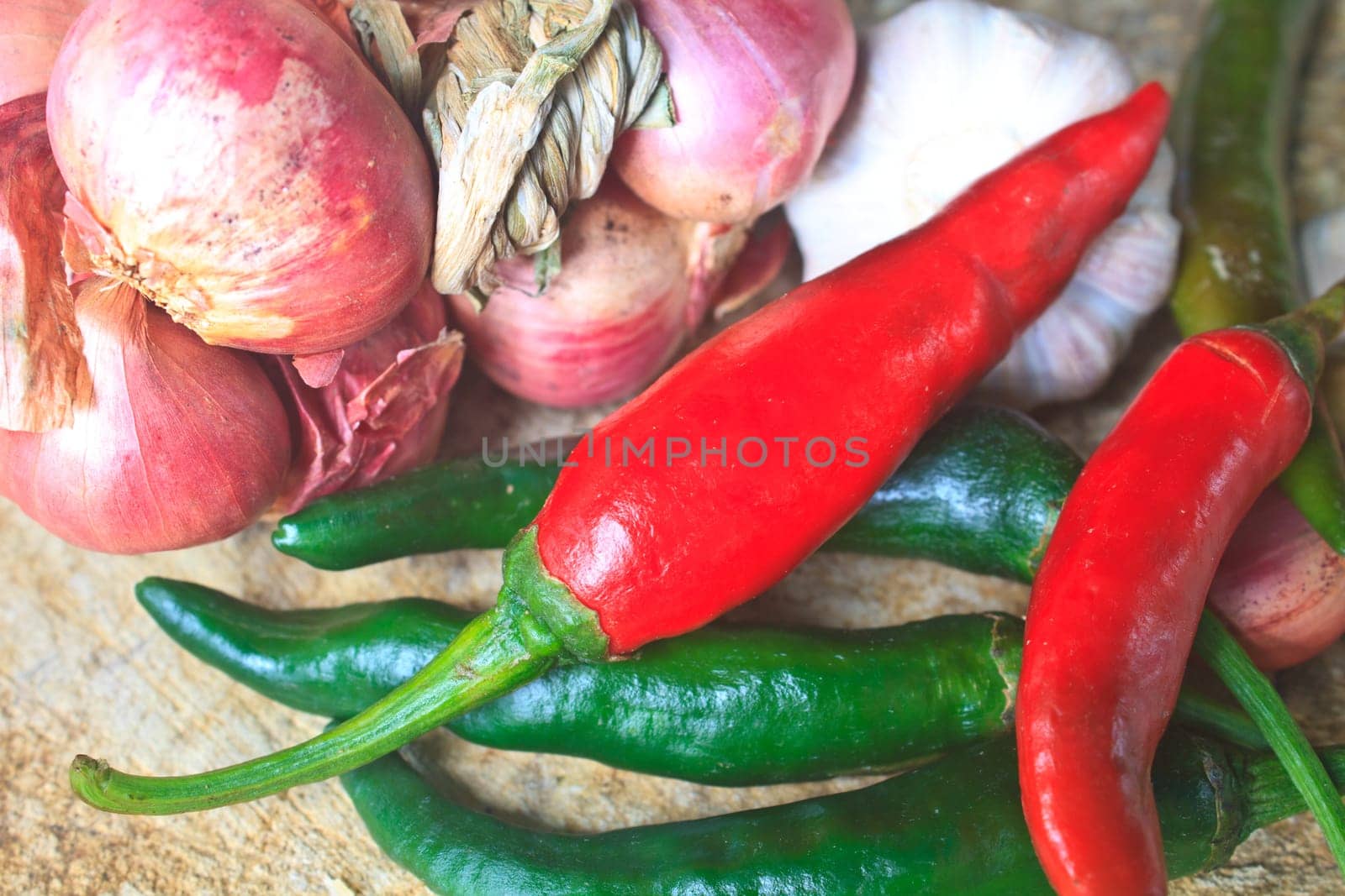 thai kitchen food spice herb pepper red onion garlic for cooking on top wood table