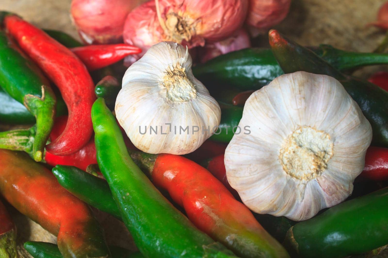 thai kitchen food spice herb pepper red onion garlic for cooking on top wood table