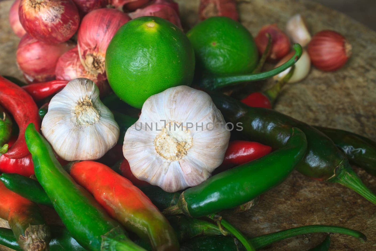 thai kitchen food spice herb pepper red onion garlic for cooking on top wood table