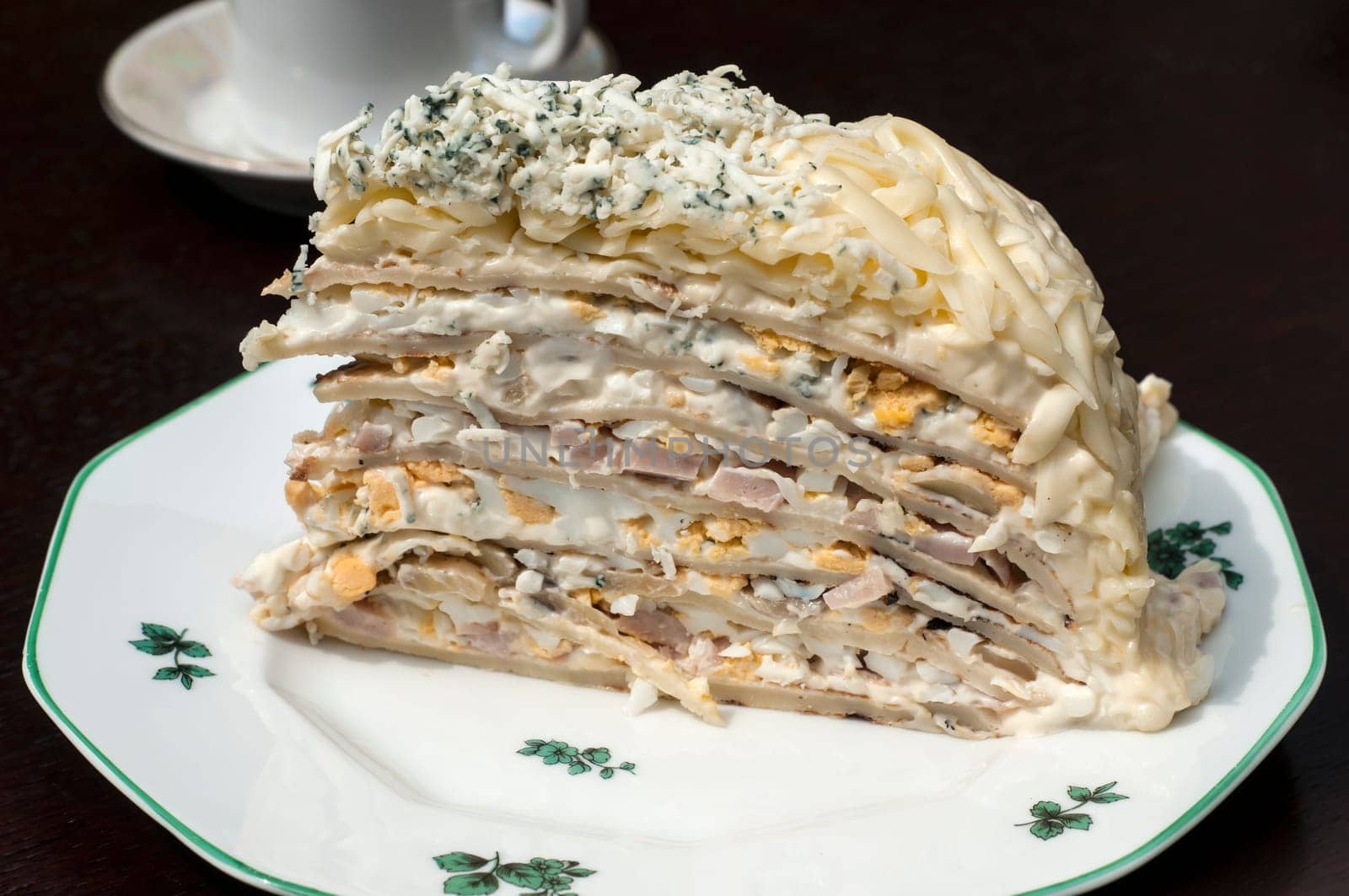 Homemade salty pancake cake piece in plate