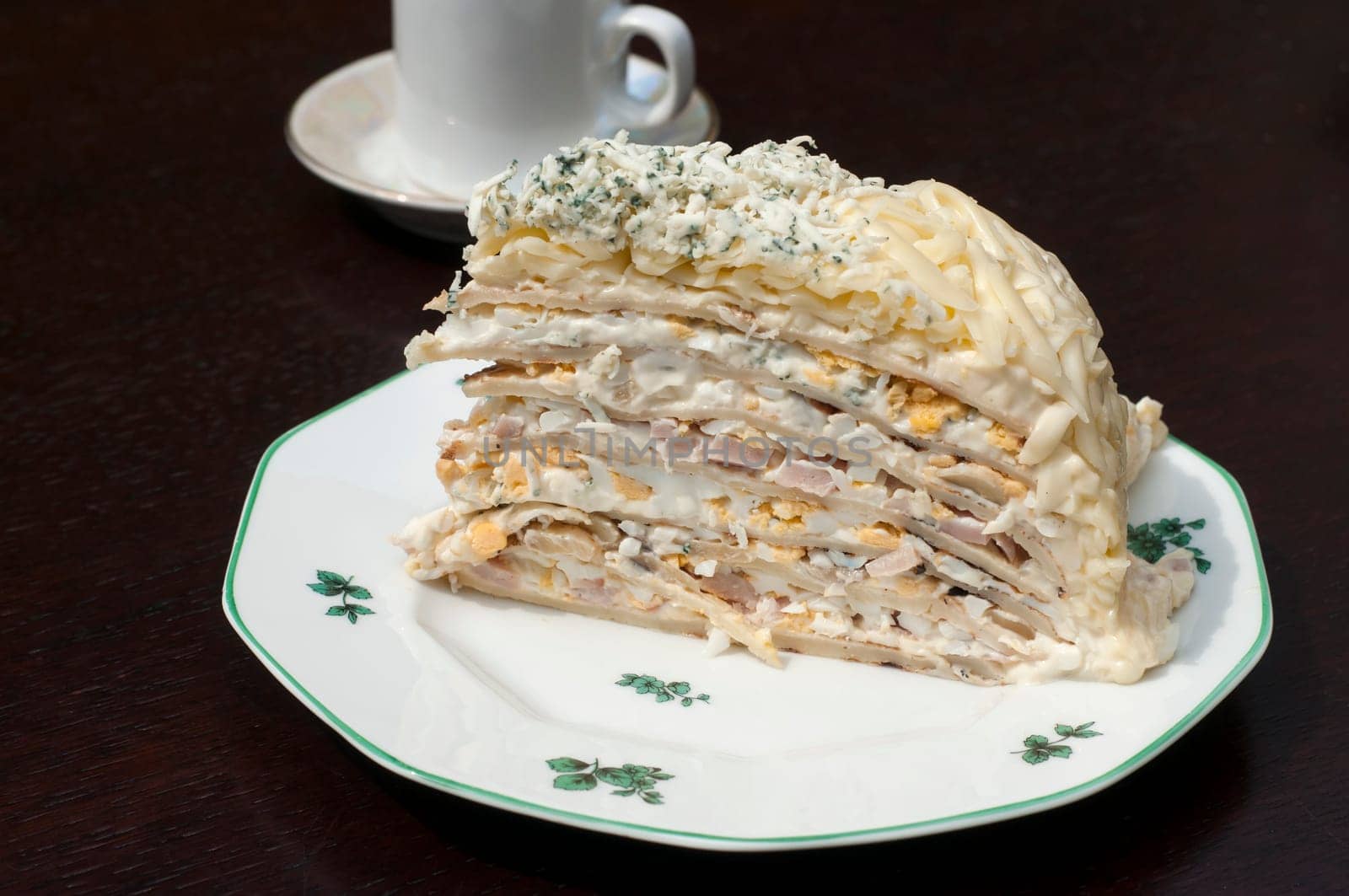 Homemade salty pancake cake piece in plate
