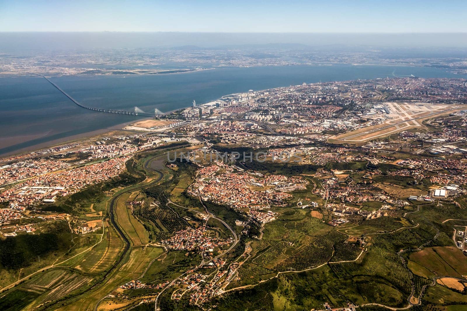 View over Lisbon, Portugal with airport, ponte vasco da gama, river tejo