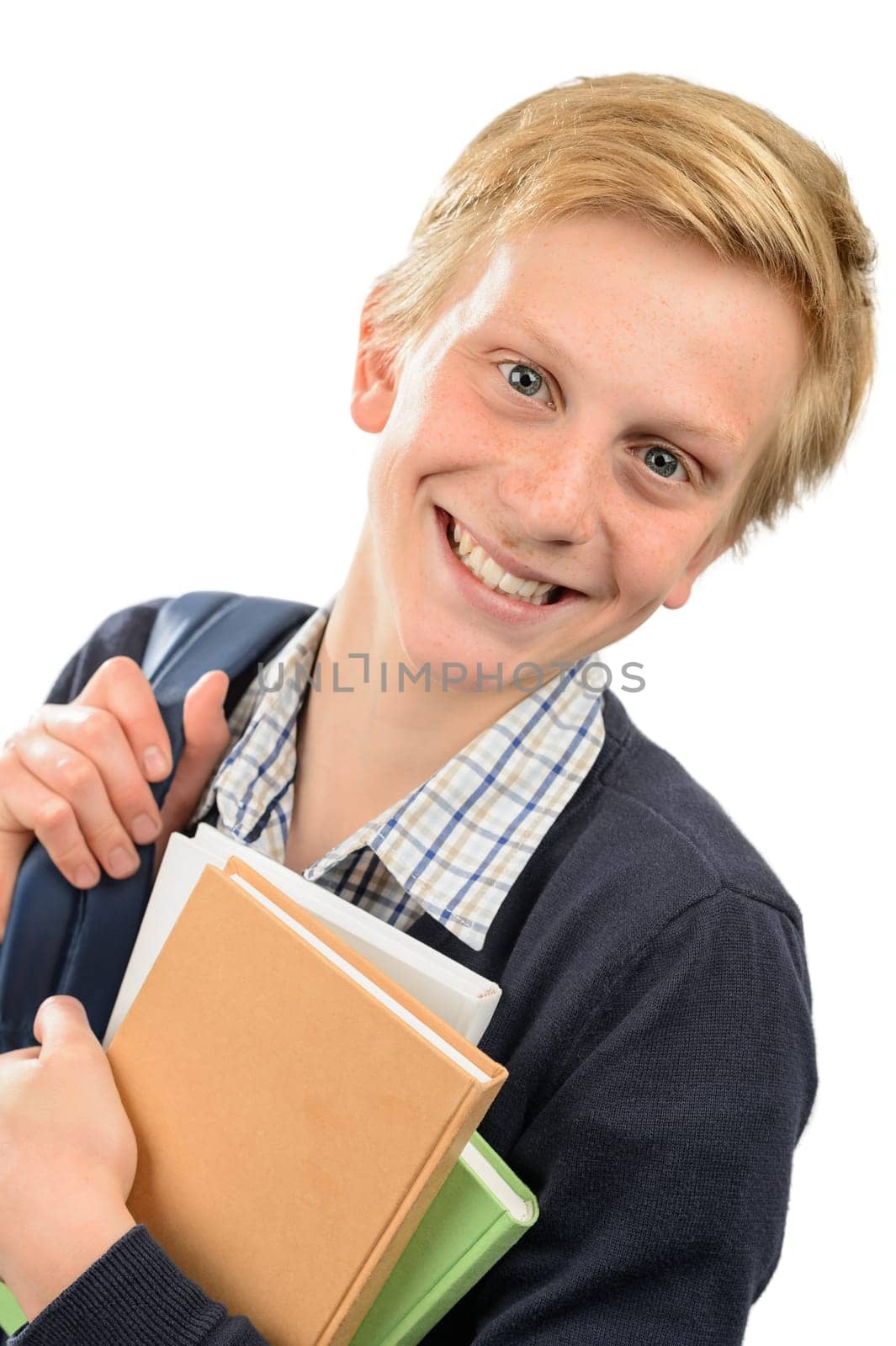 Happy teenage student boy holding books against white background