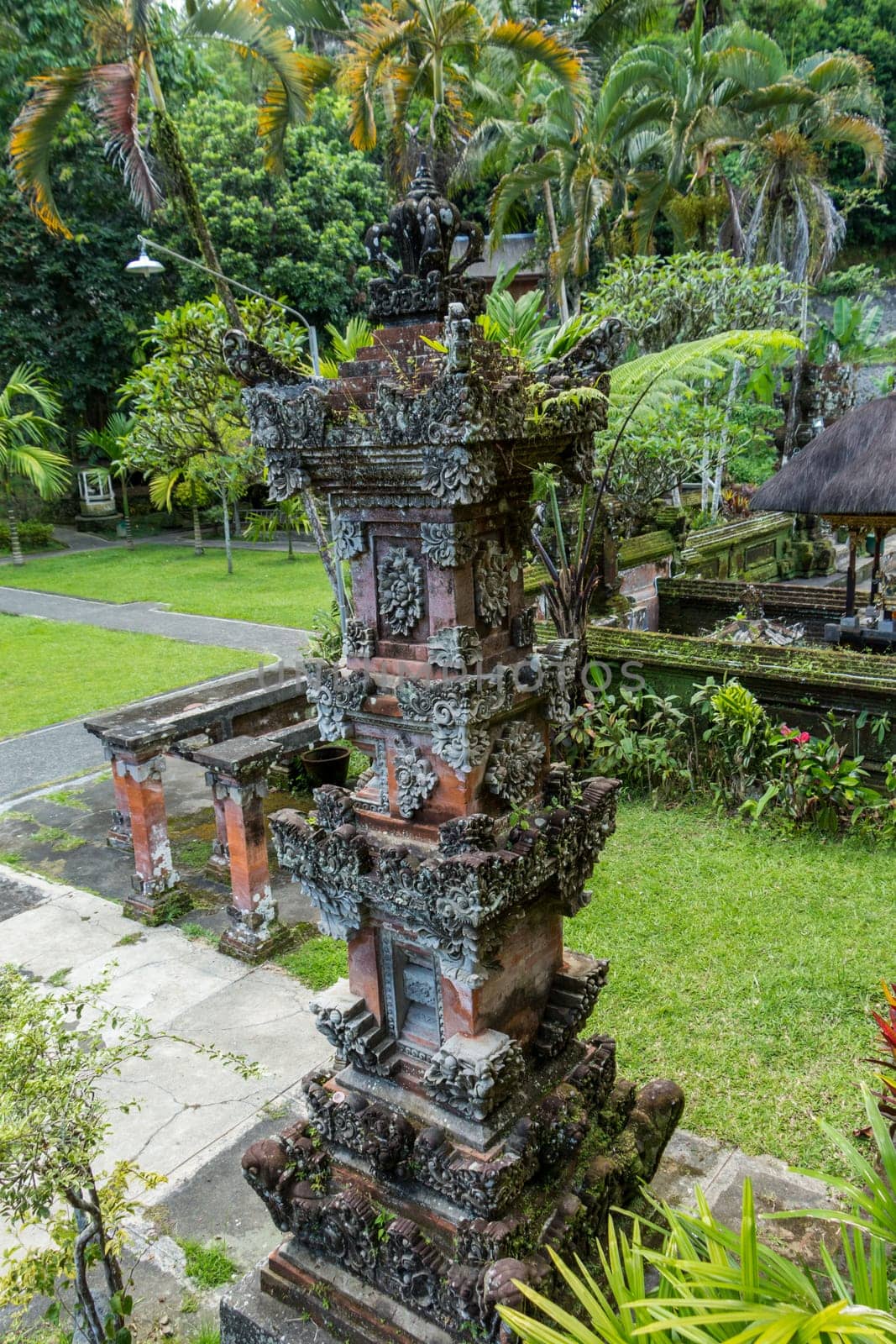 Artful carvings in stone stonemasonry in a green complex in Bali