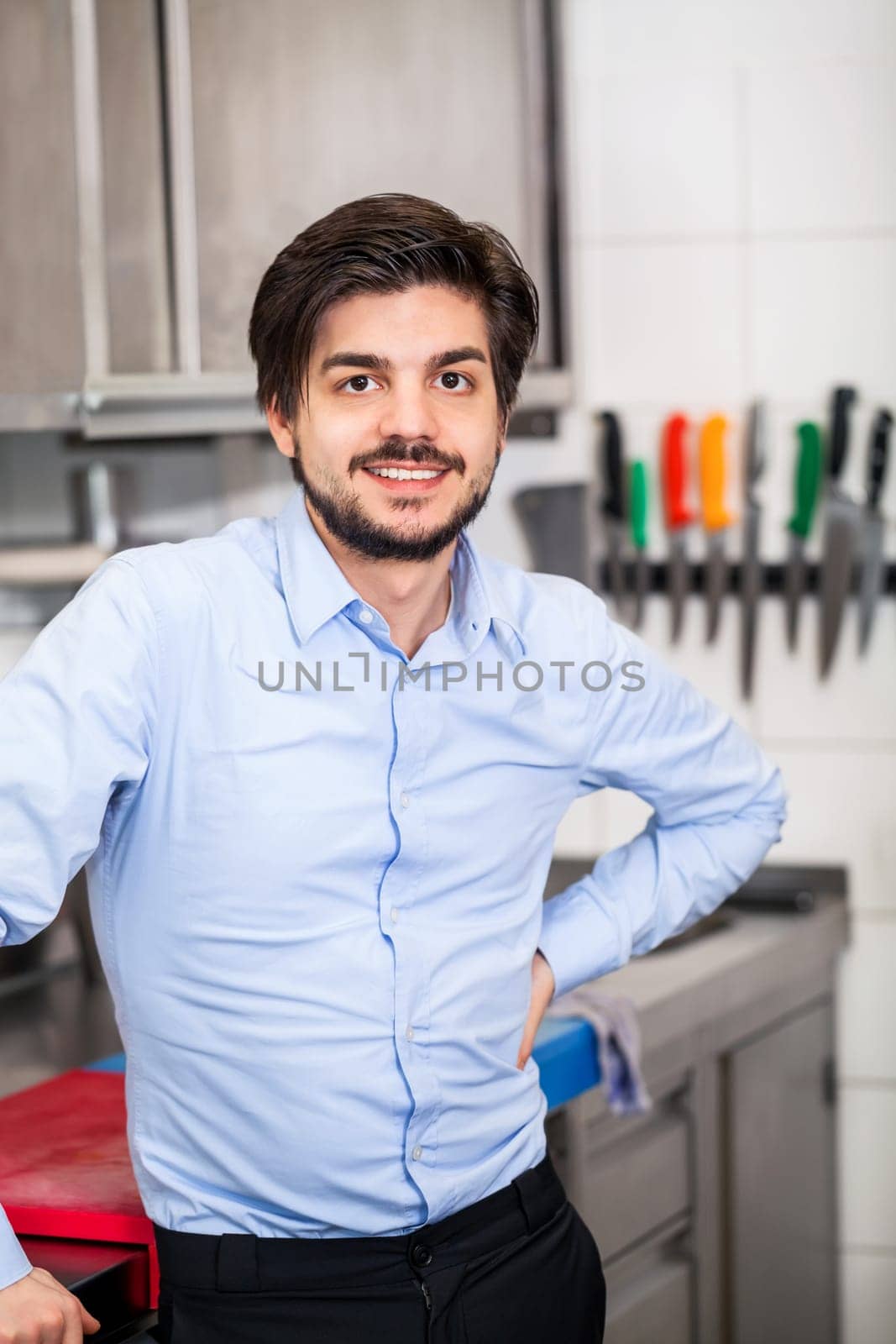 restaurant chef chef owner in the kitchen portrait proudly successful