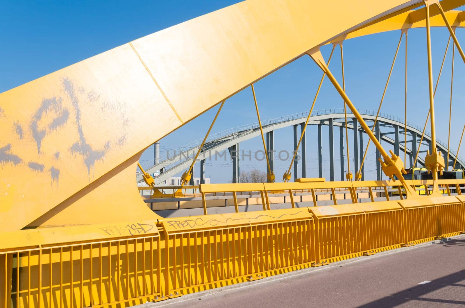 detail of the yellow arch bridge in Utrecht, netherlands. The Hogeweide Bridge is a steel arch bridge over the Amsterdam-Rhine Canal