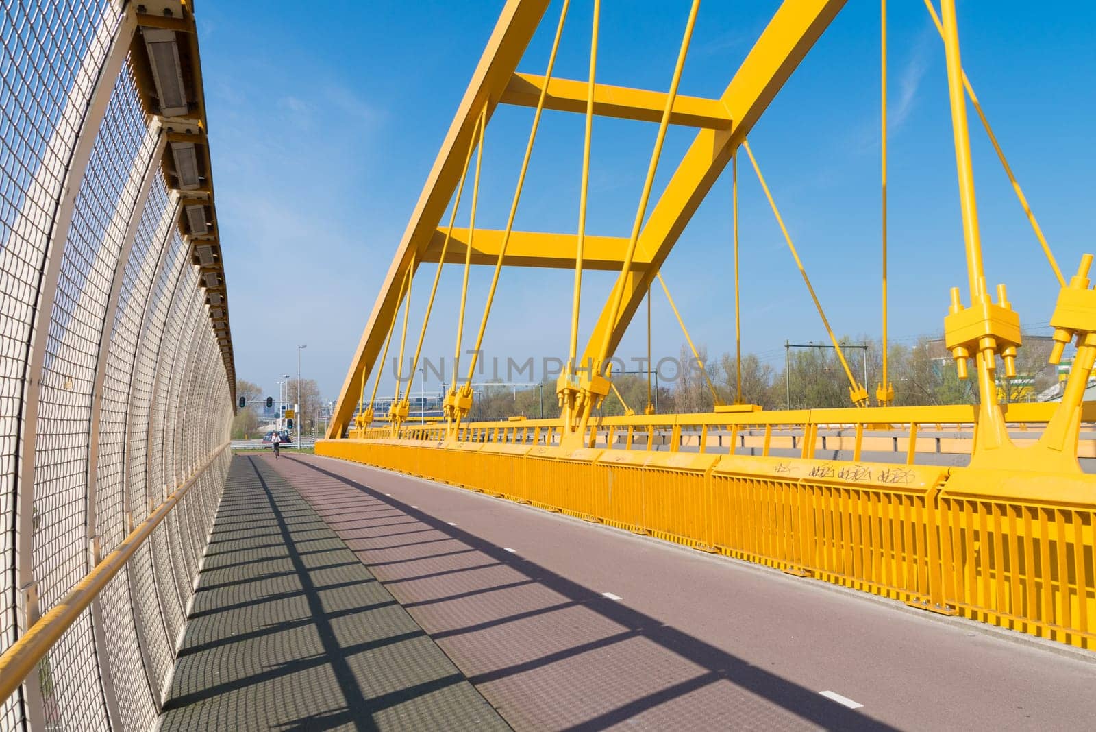 detail of the yellow arch bridge in Utrecht, netherlands. The Hogeweide Bridge is a steel arch bridge over the Amsterdam-Rhine Canal