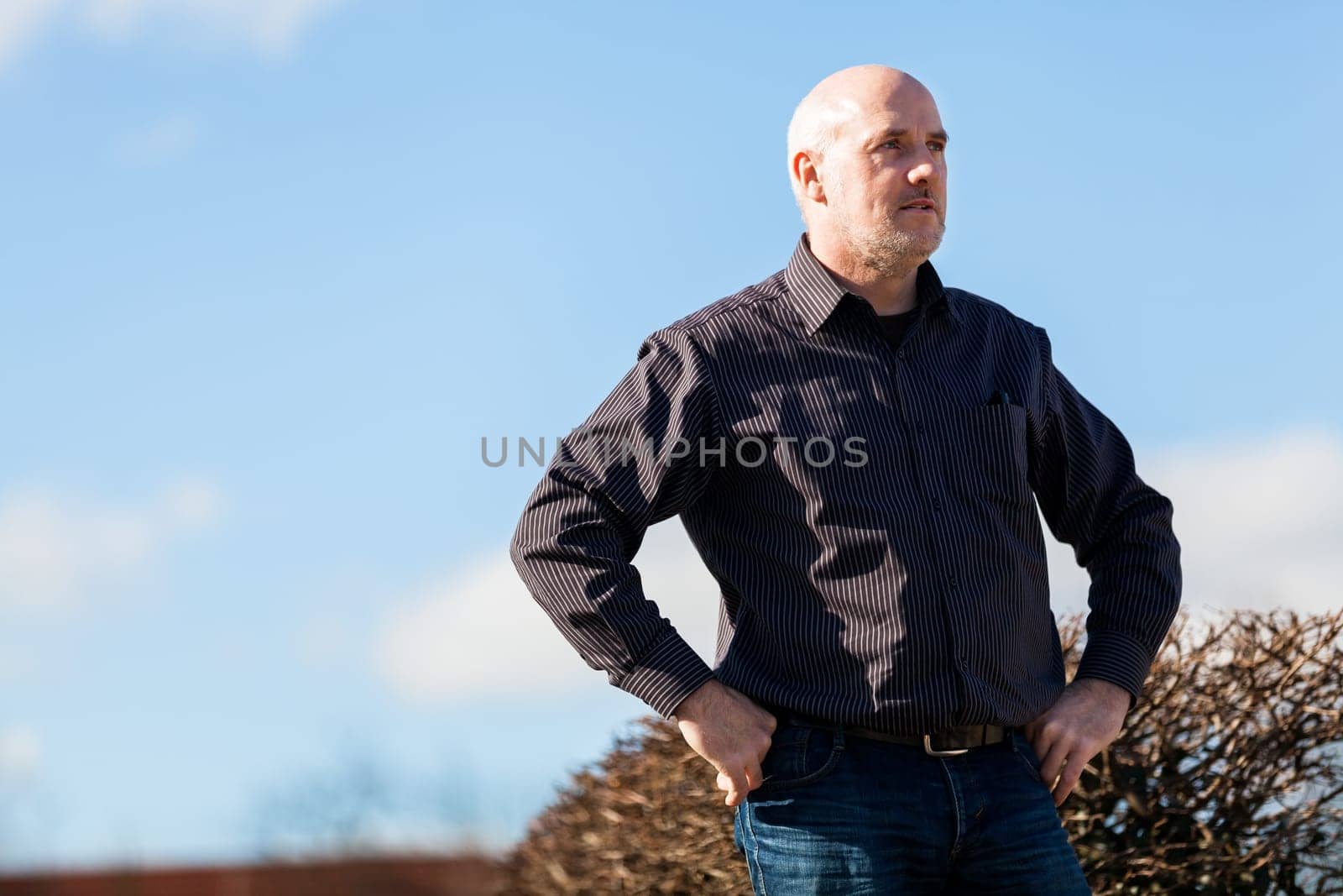 Man middle-aged senior pensioner taking a break in the outdoor park