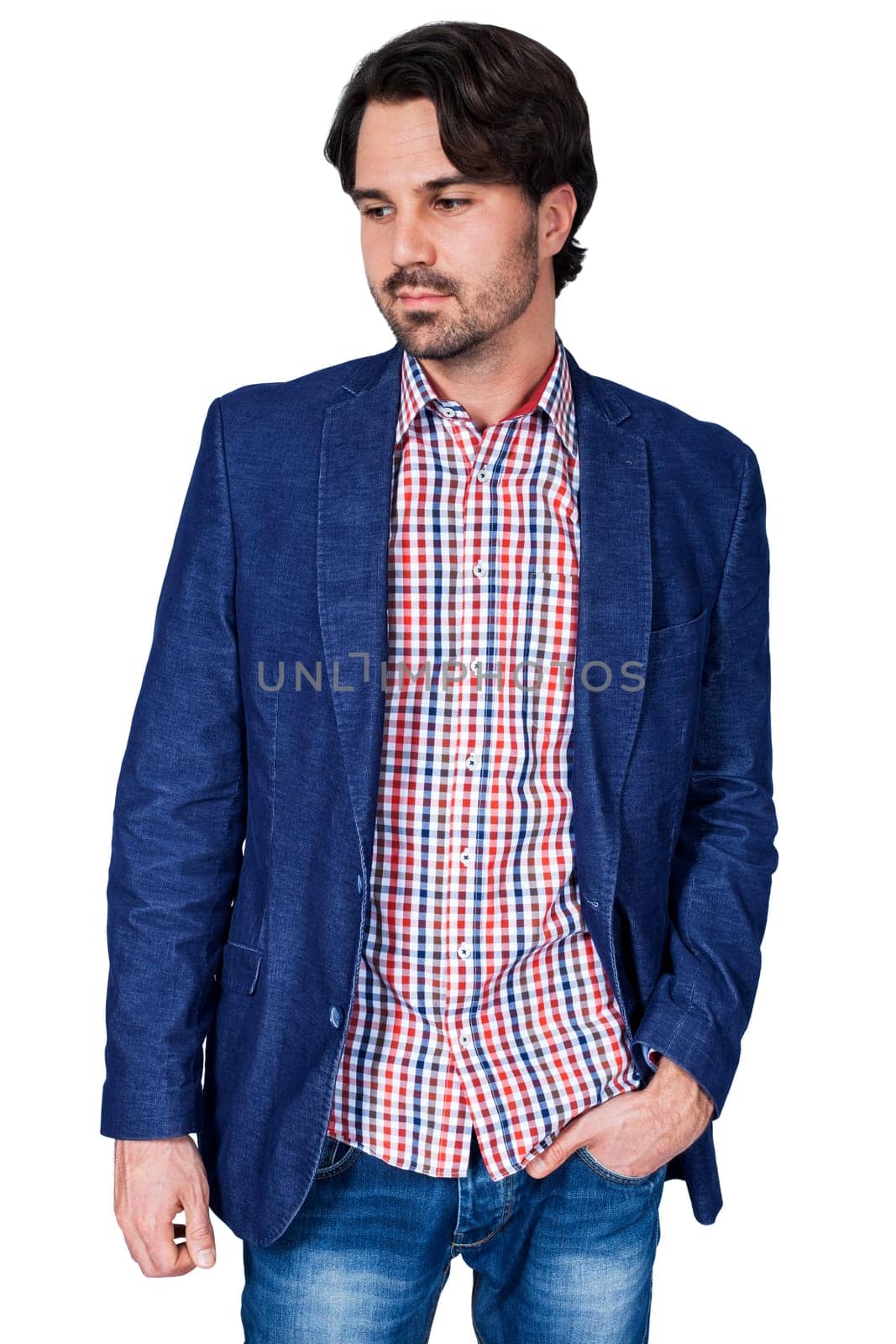 Young man in trendy casual look with dark hair and beard isolated against a white background